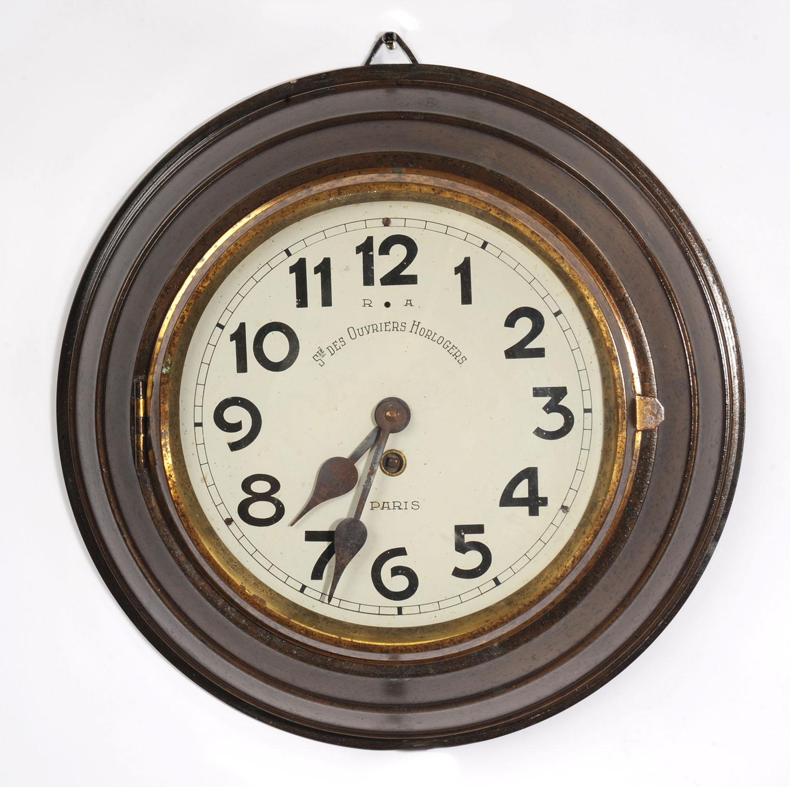 A wonderful original antique French bronze wall clock by Sté des Ouvriers Horlogers, circa 1920. Found by our buyer in a long derelict workshop it has been worn by years of neglect with a wonderful patina of tarnish and rust. The mellow bronze