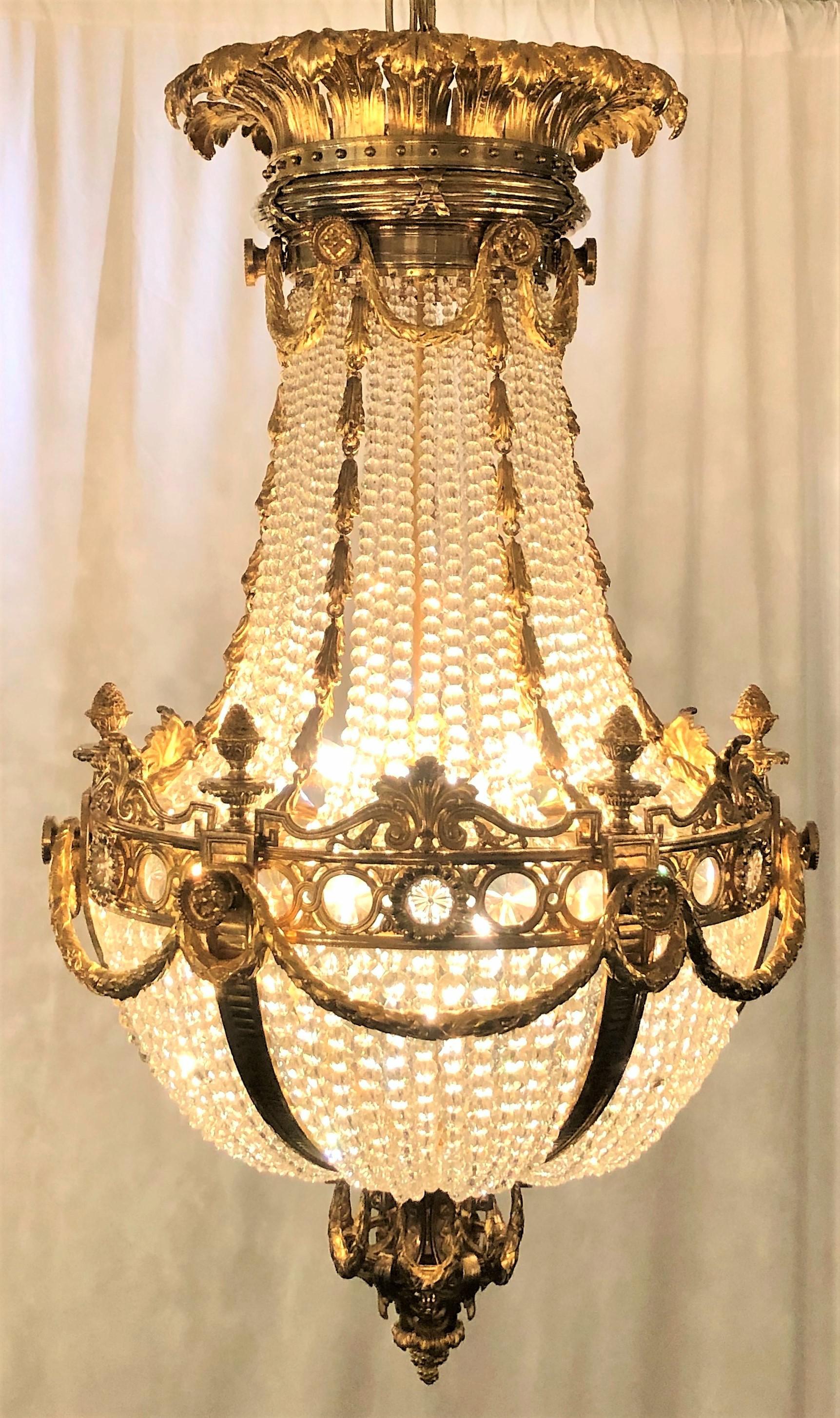 Antique French bronze dore and baccarat crystal neoclassic chandelier.