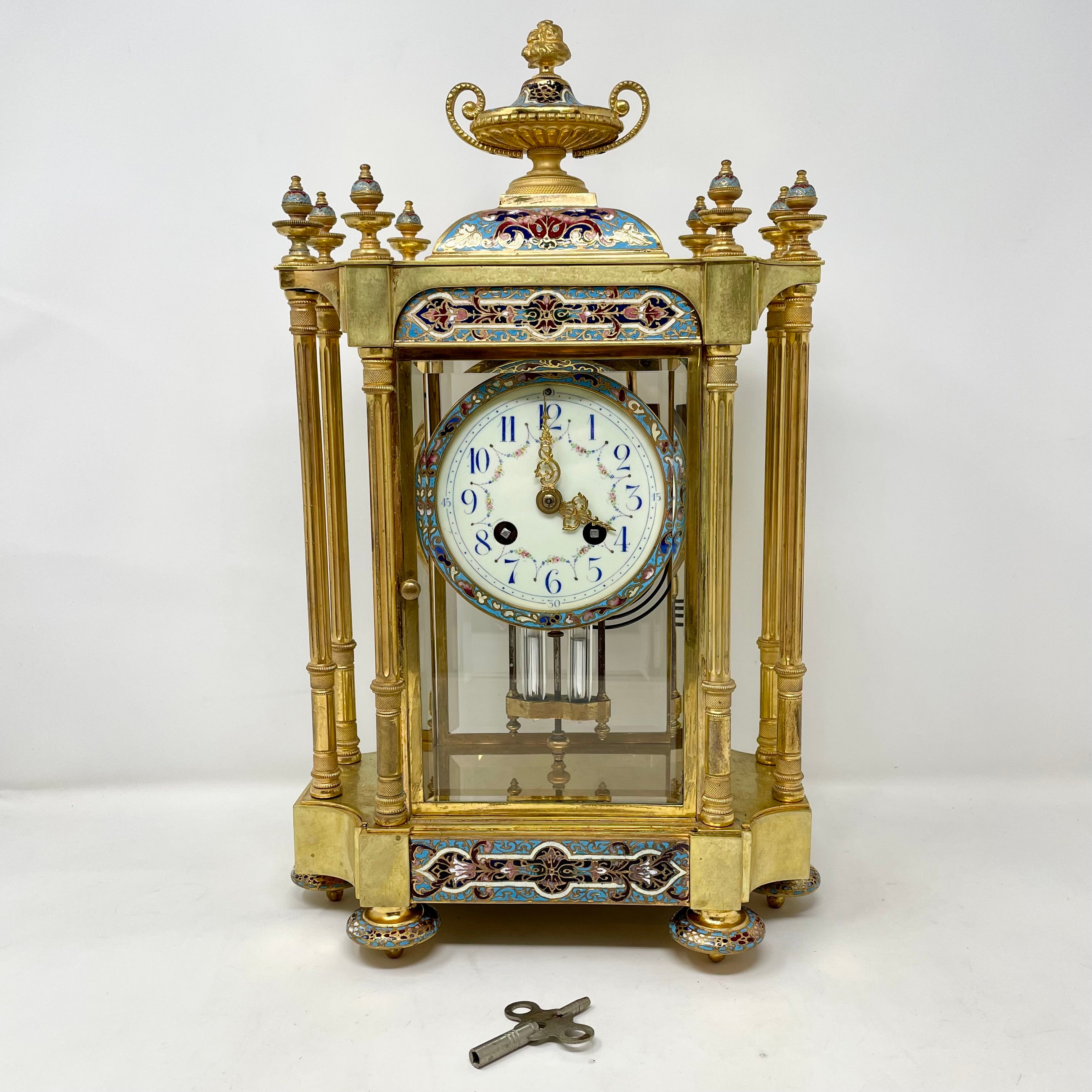 Stunning Antique French bronze d'ore clock with champlevé enamel & mercury pendulum, circa 1880's-1890's.
In working condition.