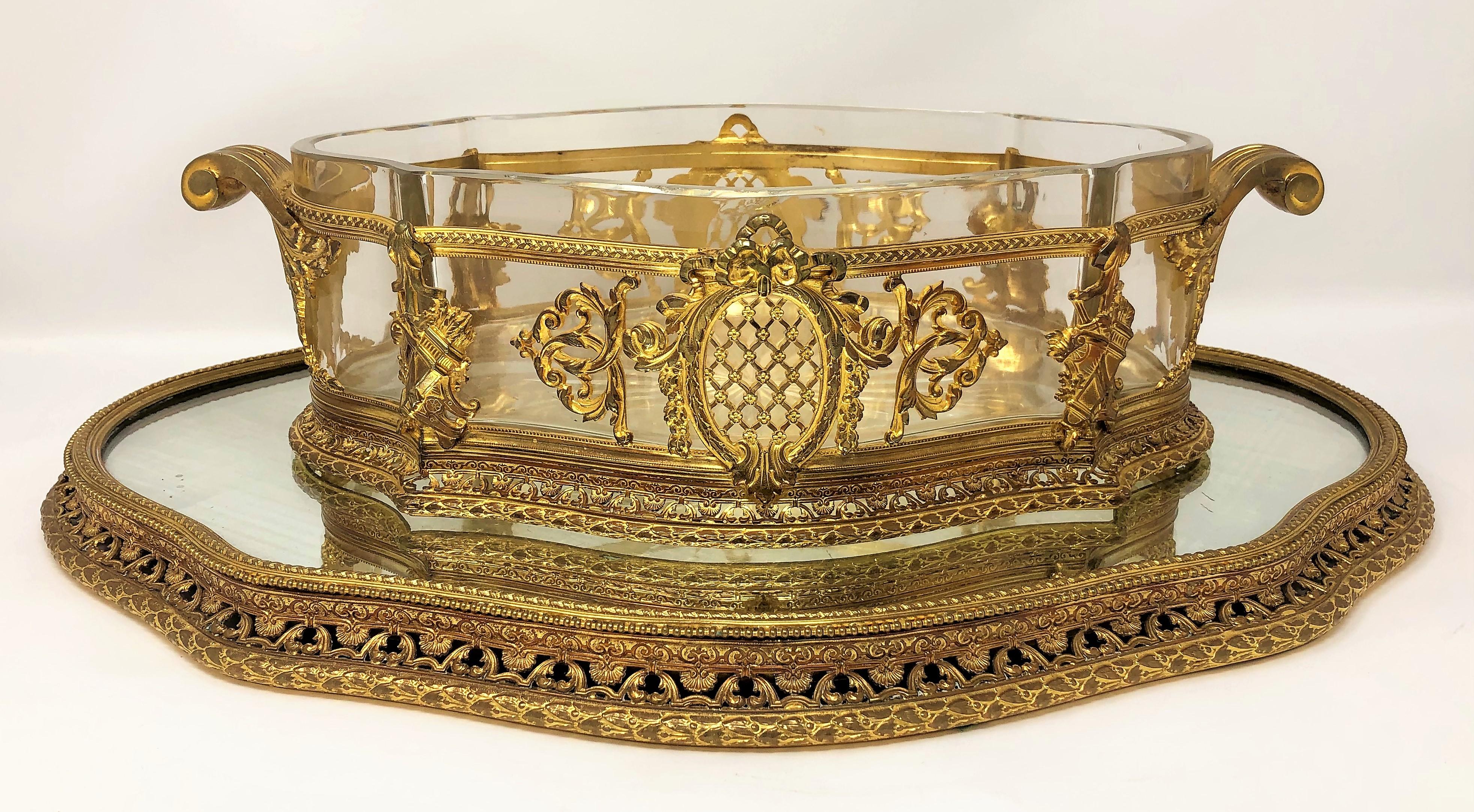 Antique French bronze D'Ore and cut crystal centerpiece with mirrored plateau, circa 1880s.
Measures: Centerpiece: 4
