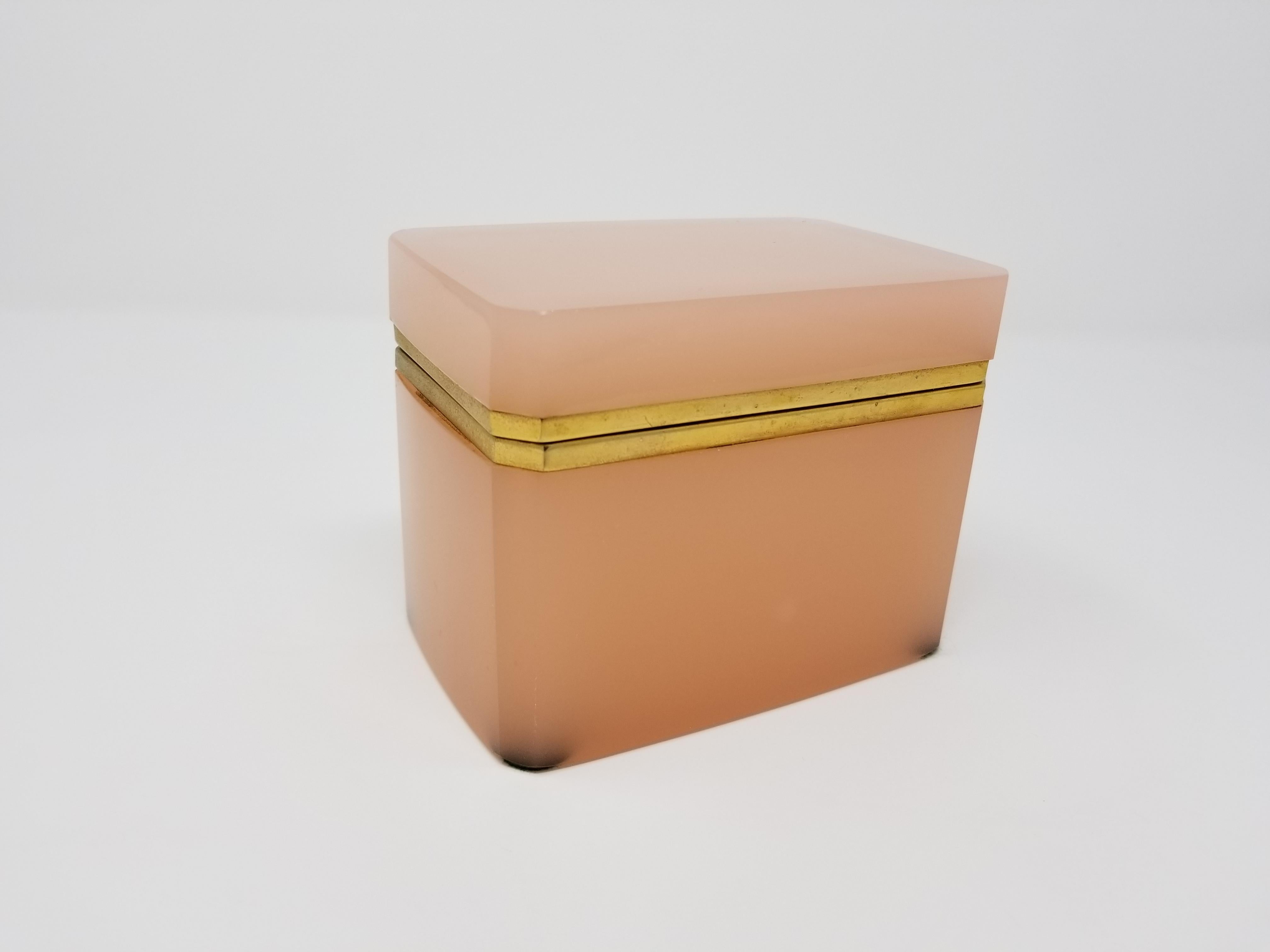 A beautiful French bronze doré mount hand-diamond cut-crystal peach pink opaline casket box with clipped corners. Opaline of this quality and color is truly difficult to find. Each section of this crystal box has been carefully hand-diamond cut with