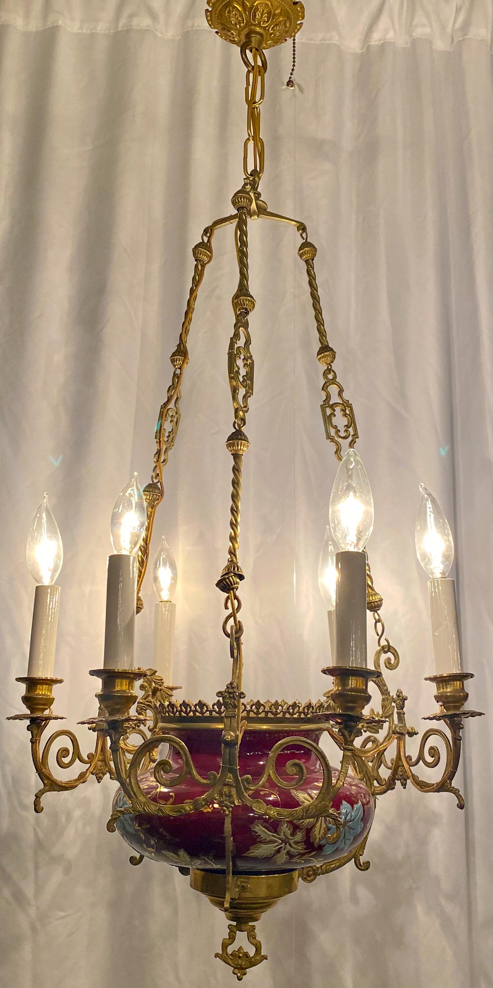 Antique French bronze doré porcelain chandelier, circa 1890. Porcelain features red glaze with floral painting.