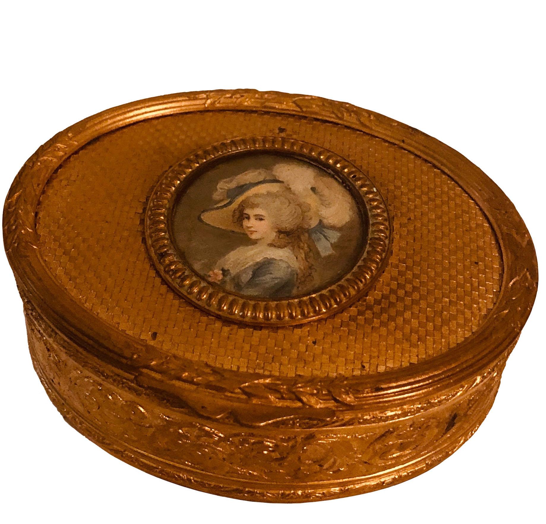 A strikingly beautiful French dore bronze box is all engraved with an ivory picture of an aristocrat, LeBron. The box is heavily chased with a velvet interior in red thats is original to the century. Circa 1890, France