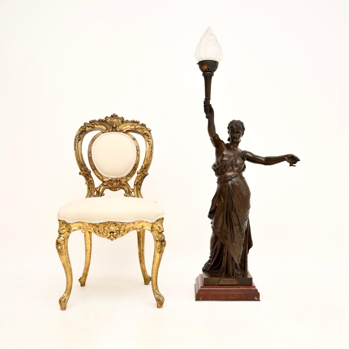 A magnificent antique French bronze lamp figure ‘La Paix’ by Jean-Jules Cambos (1828-1917). This dates from around the 1880-1890 period.

It is very large and impressive, it is of outstanding quality and it is a functional sculpture, with a fully