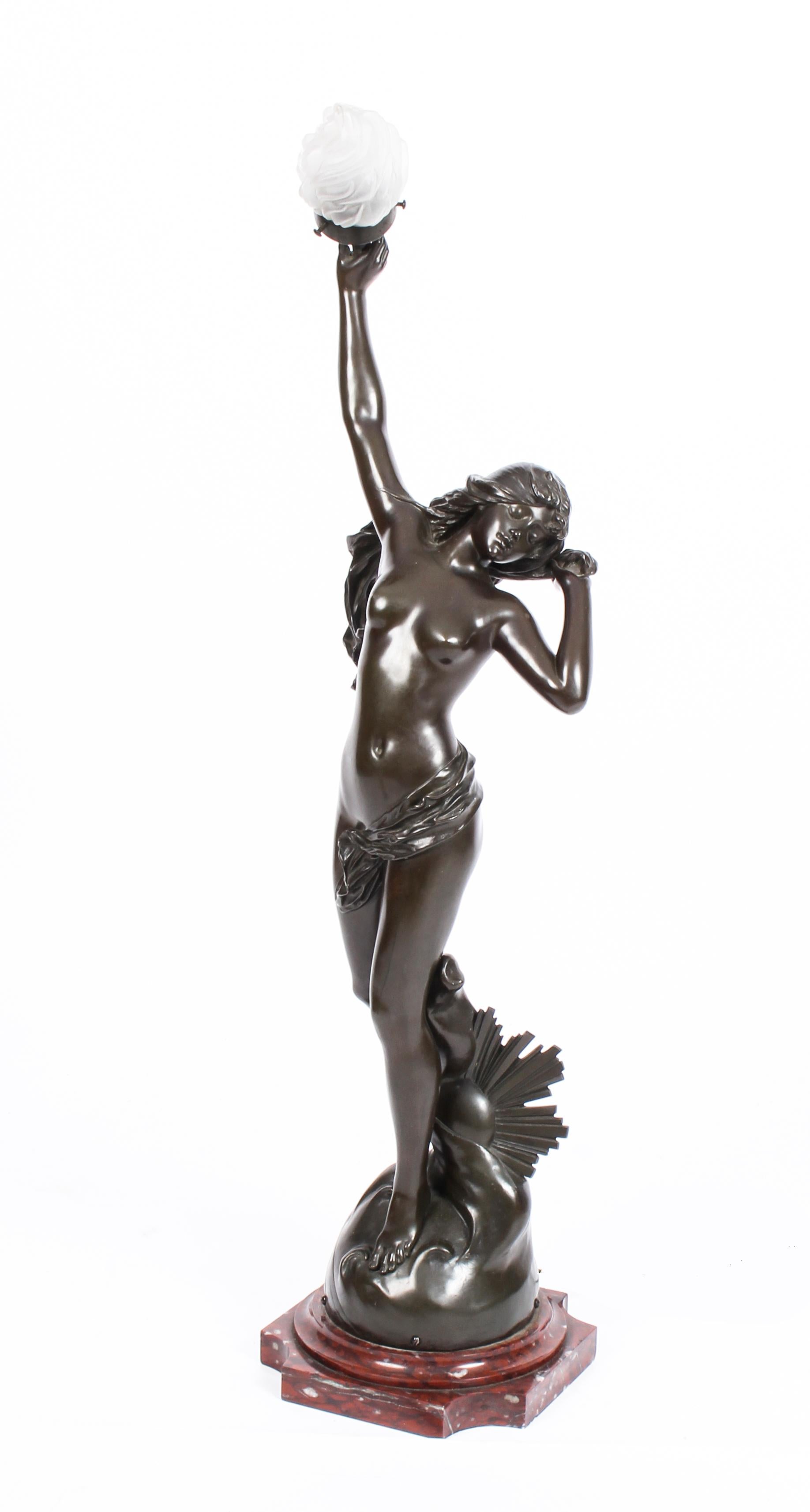This is a magnificent large antique French bronze lamp depicting the female nude 'Sunset', by the renowned Parisian sculptor Edouard Drout (1859-1945), circa 1890 in date on a stunning antique pedestal, circa 1860 in date.

This striking lamp