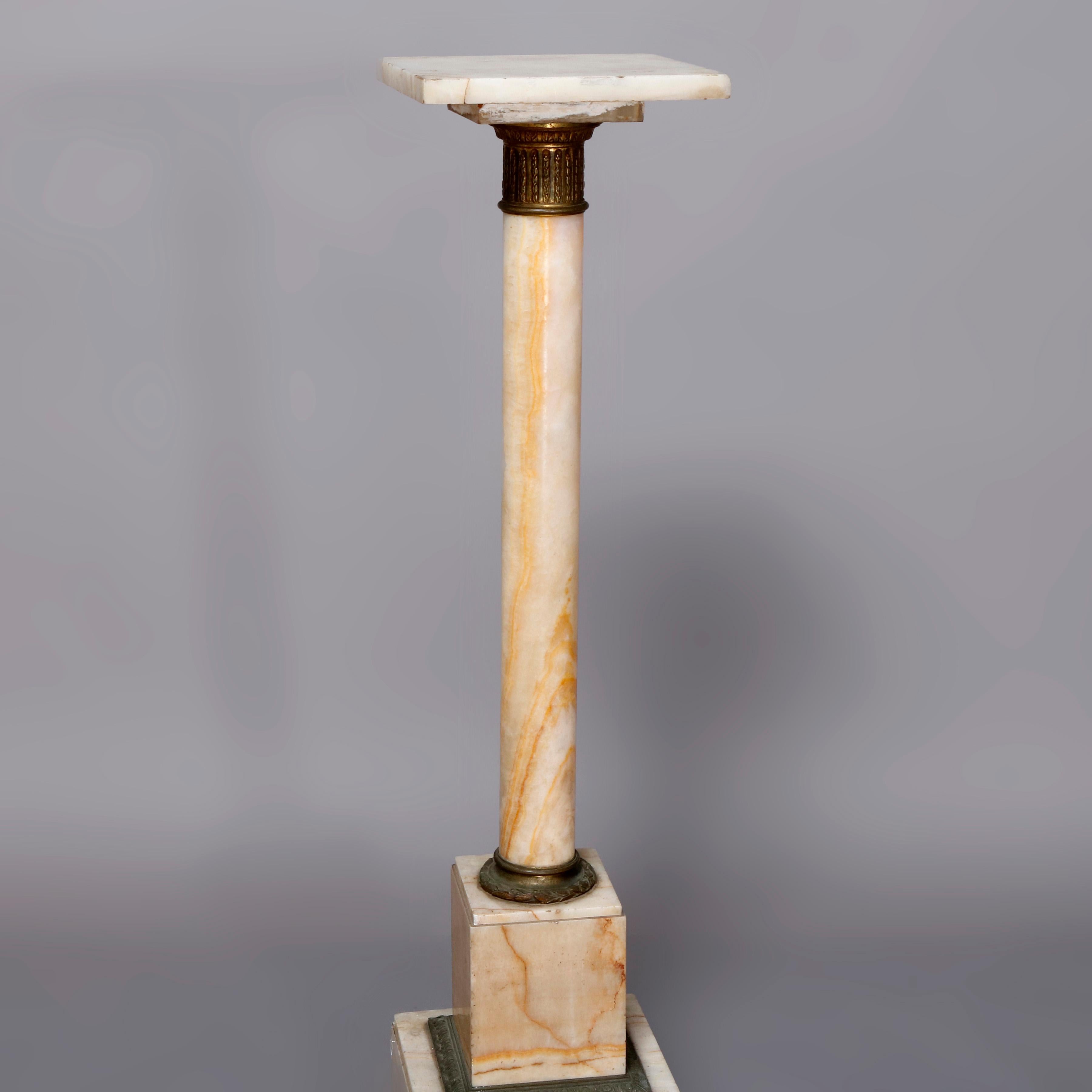 An antique French Classical Corinthian Column display pedestal offers marble construction having footed and stepped base surmounted by round column and square sculpture display with cast bronze mounts, circa 1890.

***DELIVERY NOTICE – Due to