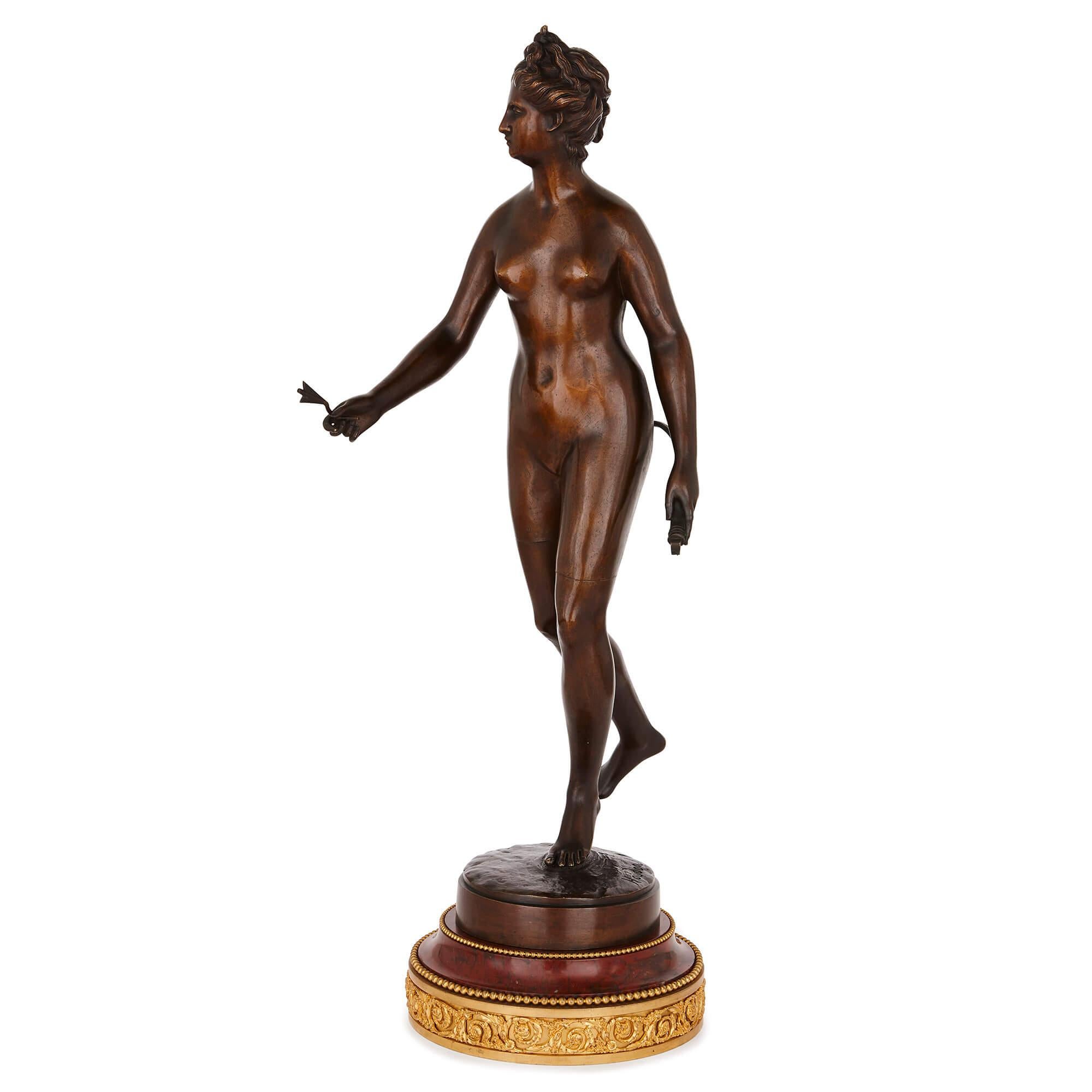 This beautiful patinated bronze figure is titled 'Diana Chasseresse', or 'Diana Huntress', and depicts the Roman goddess Diana, goddess of hunting. It replicates an important work of French Neoclassicism in the late 18th Century, by Jean-Antoine