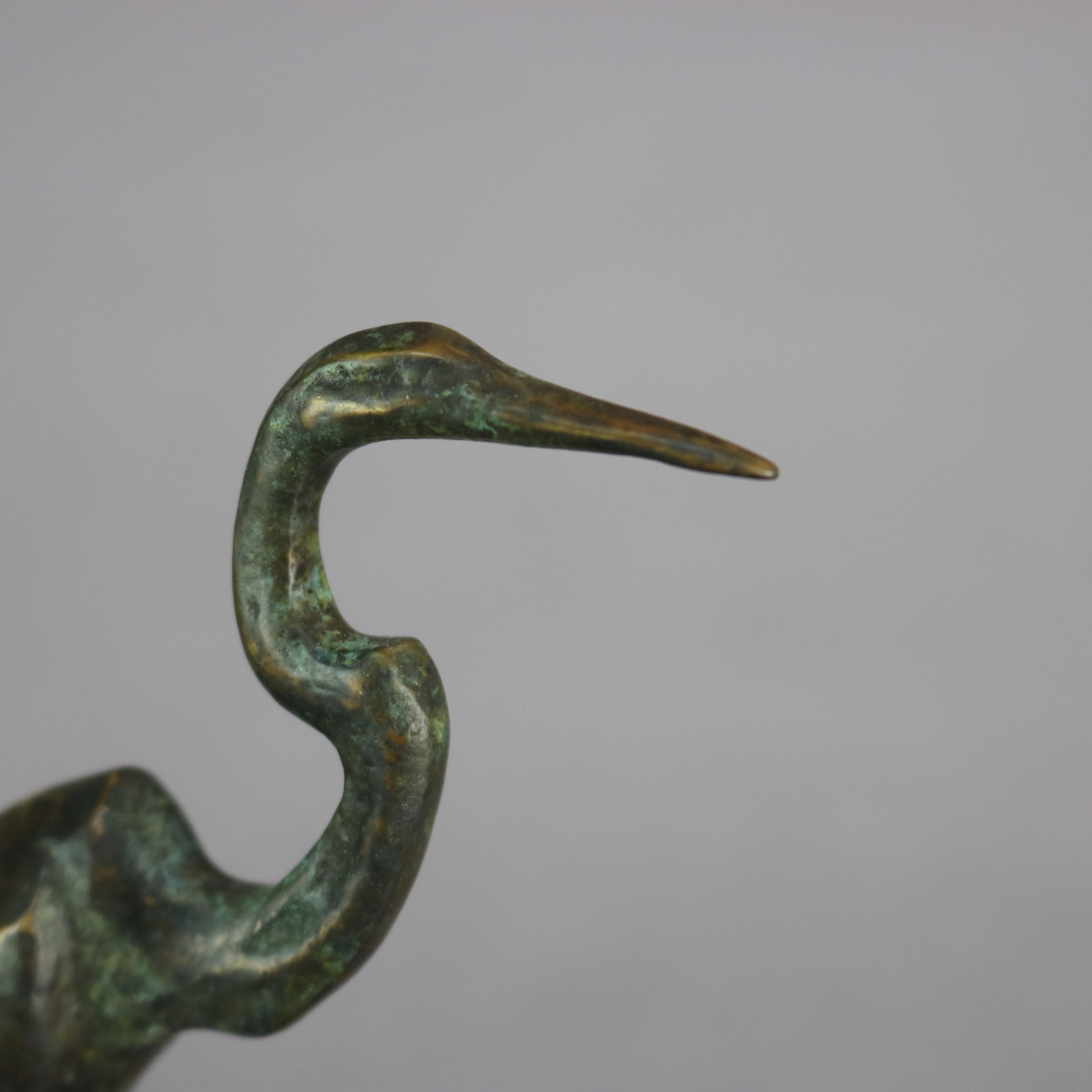 An antique French bronze sculpture depicts a Great Blue Heron in marsh setting, 
Bronze Heron Sculpture, stamped 