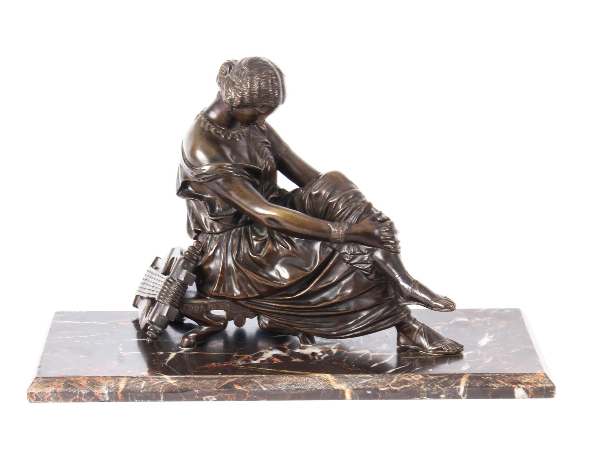 This is a magnificent antique French patinated bronze study sculpture of the allegorical figure of the Greek poetess, Sappho, mid 19th century in date.
 
This spectacular and exquisitely executed antique bronze sculpture is after the original