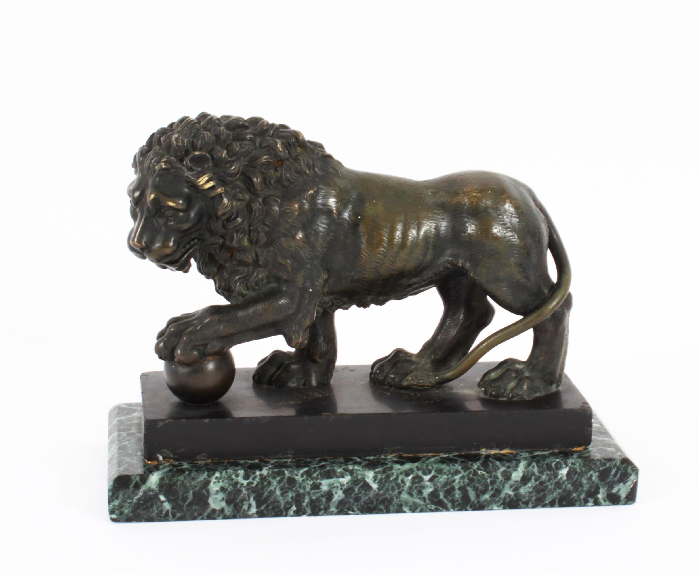 This is a beautiful antique French Grand Tour bronze sculpture of The Medici Lion, circa 1870 in date.
 
The sculptures depict a standing male lion looking to one side with a sphere or ball under one paw, raised on a stepped rectangular bronze and