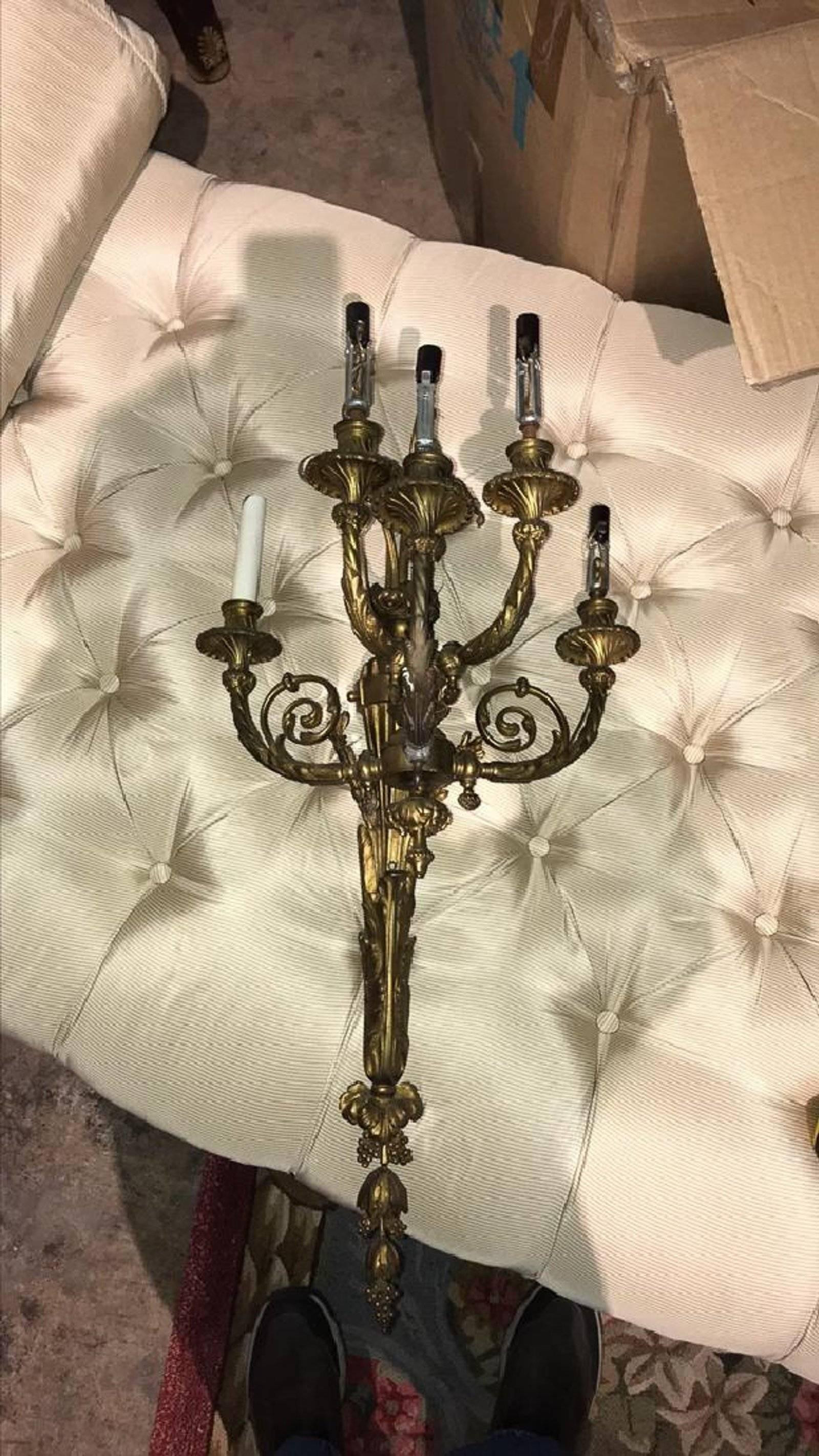 Impressive 19th century French bronze five-light wall sconce in the Rococo Revival style with reticulated leaf scrolls and grape cluster finial.