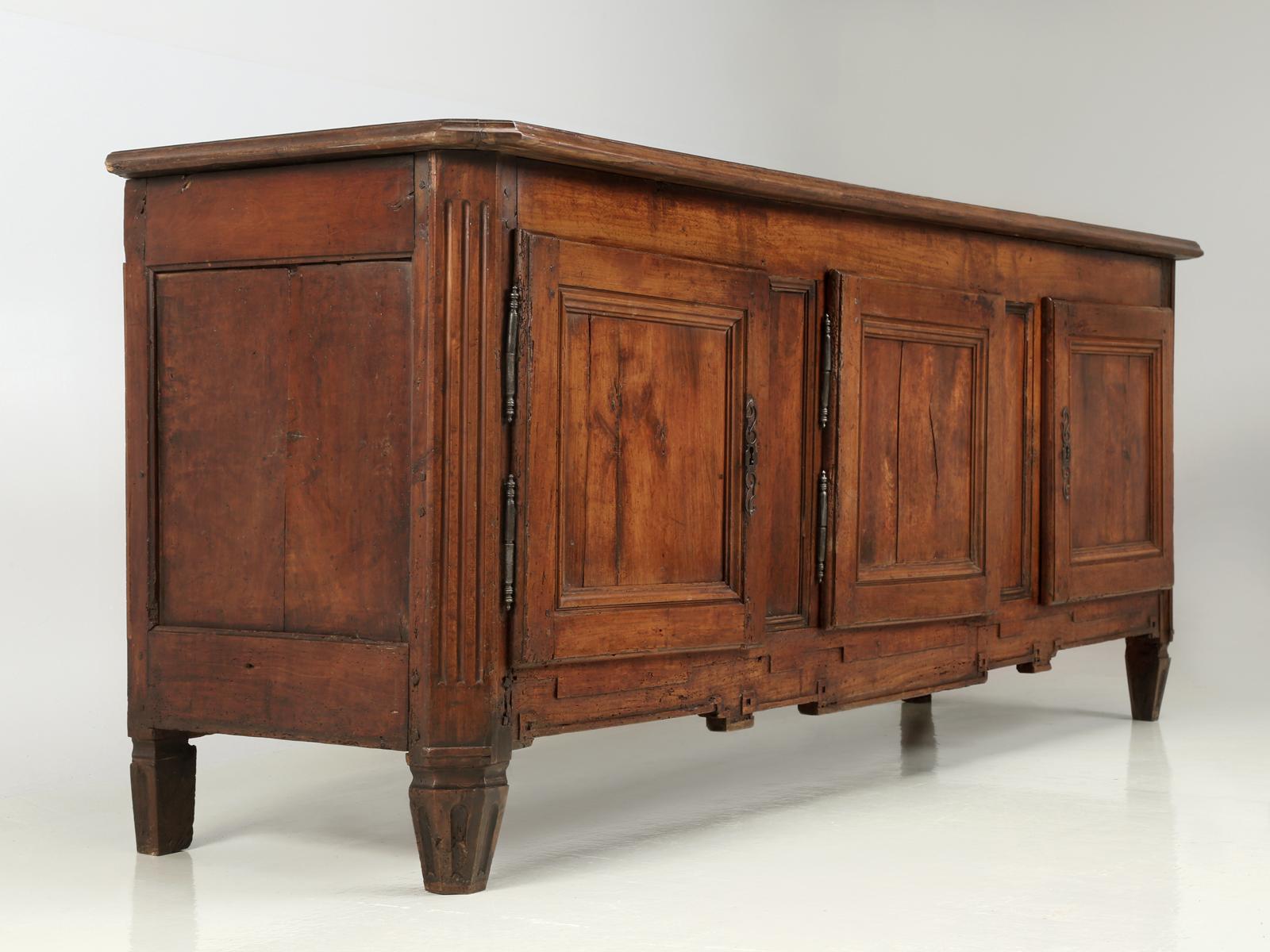 We have been importing antique French furniture or in this case, an antique French buffet for almost 30-years and this style is a new one on us. Judging by the construction methods used and all the hand-sawn lumber, it is our opinion that this