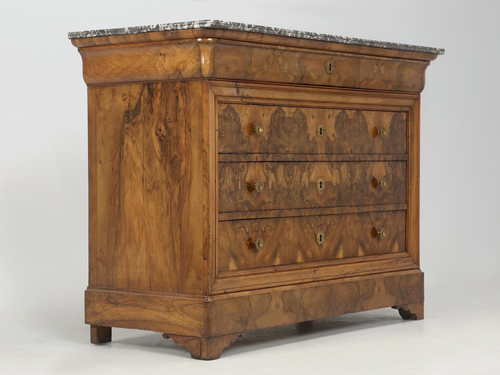 Antique French Louis Philippe chest of drawers or dresser or even commode, since all are appropriate. Our antique French chest was made from beautifully book-matched burl walnut. The marble top is not original to the French commode; however, it is