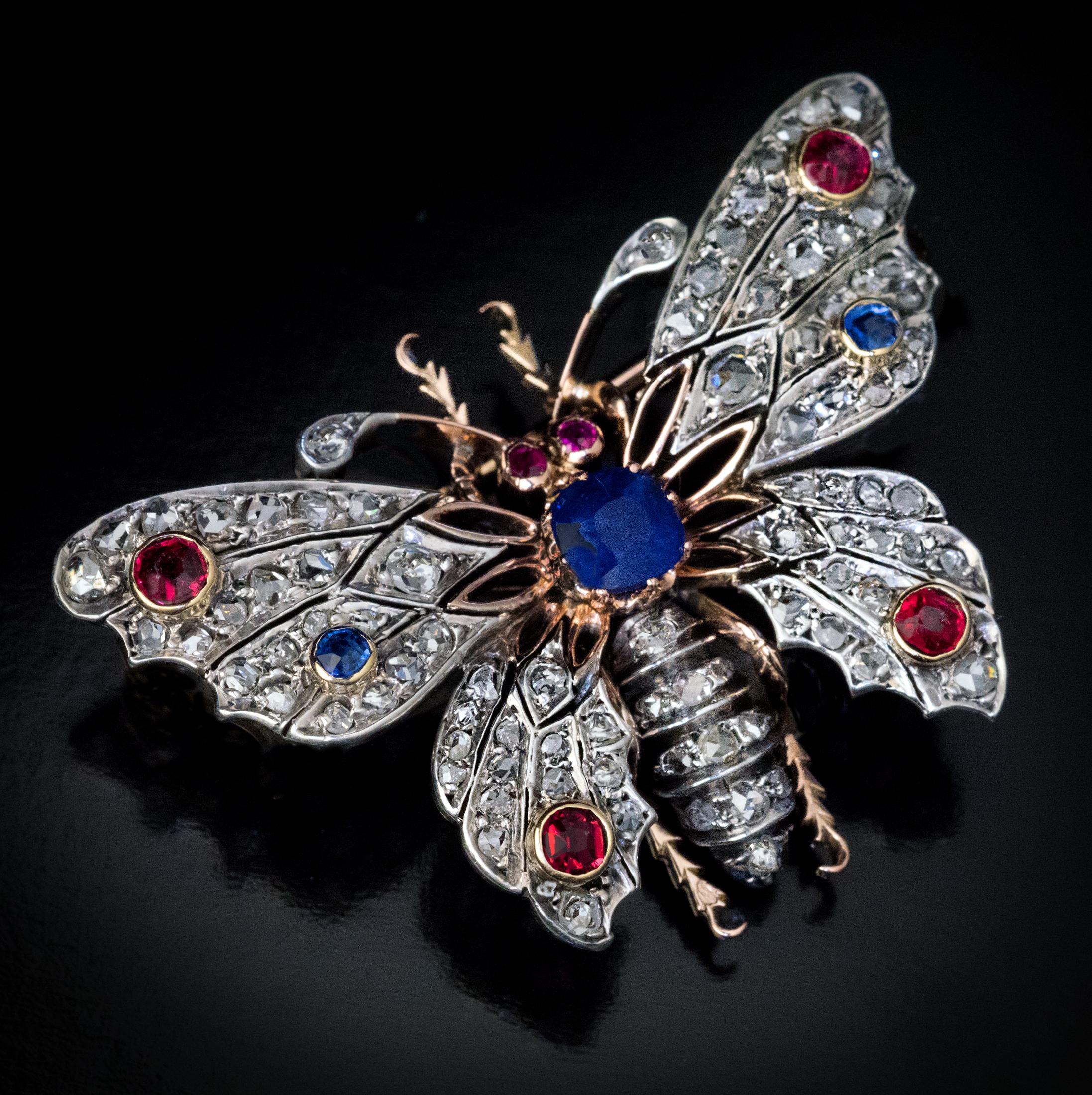 France, circa 1890s
The brooch is finely modeled as a butterfly. It is handcrafted in silver-topped 18K gold and is encrusted with rose cut diamonds, sapphires and rubies. The principal velvety blue sapphire (1.15 carats) is a natural untreated