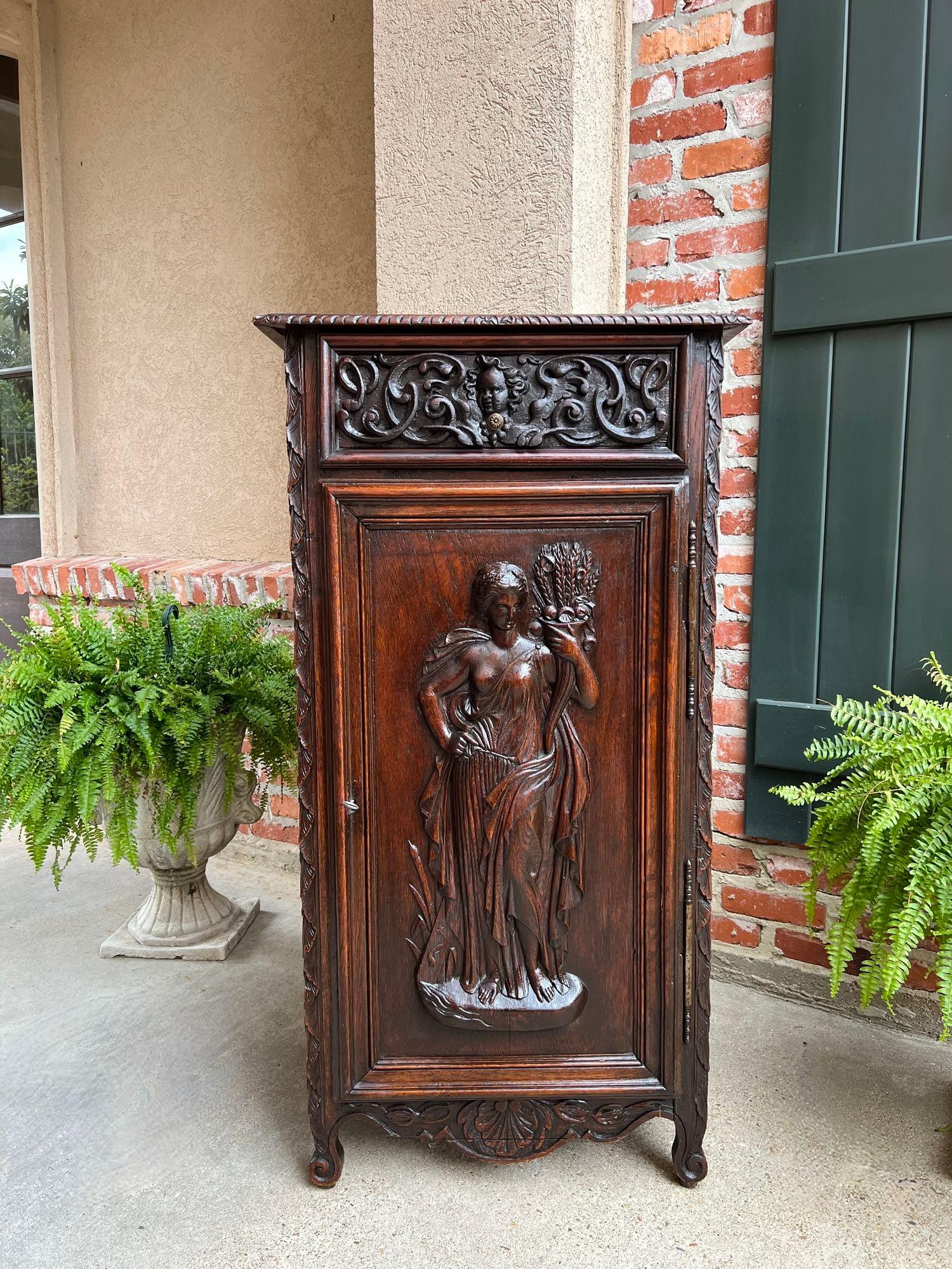 Antique French Cabinet Carved Oak Demeter Harvest Cornucopia Greek Goddess.

Direct from France, a beautifully hand carved 19th century French “confiturier’ cabinet, which is an extremely versatile size, perfect for placement in any room, and a