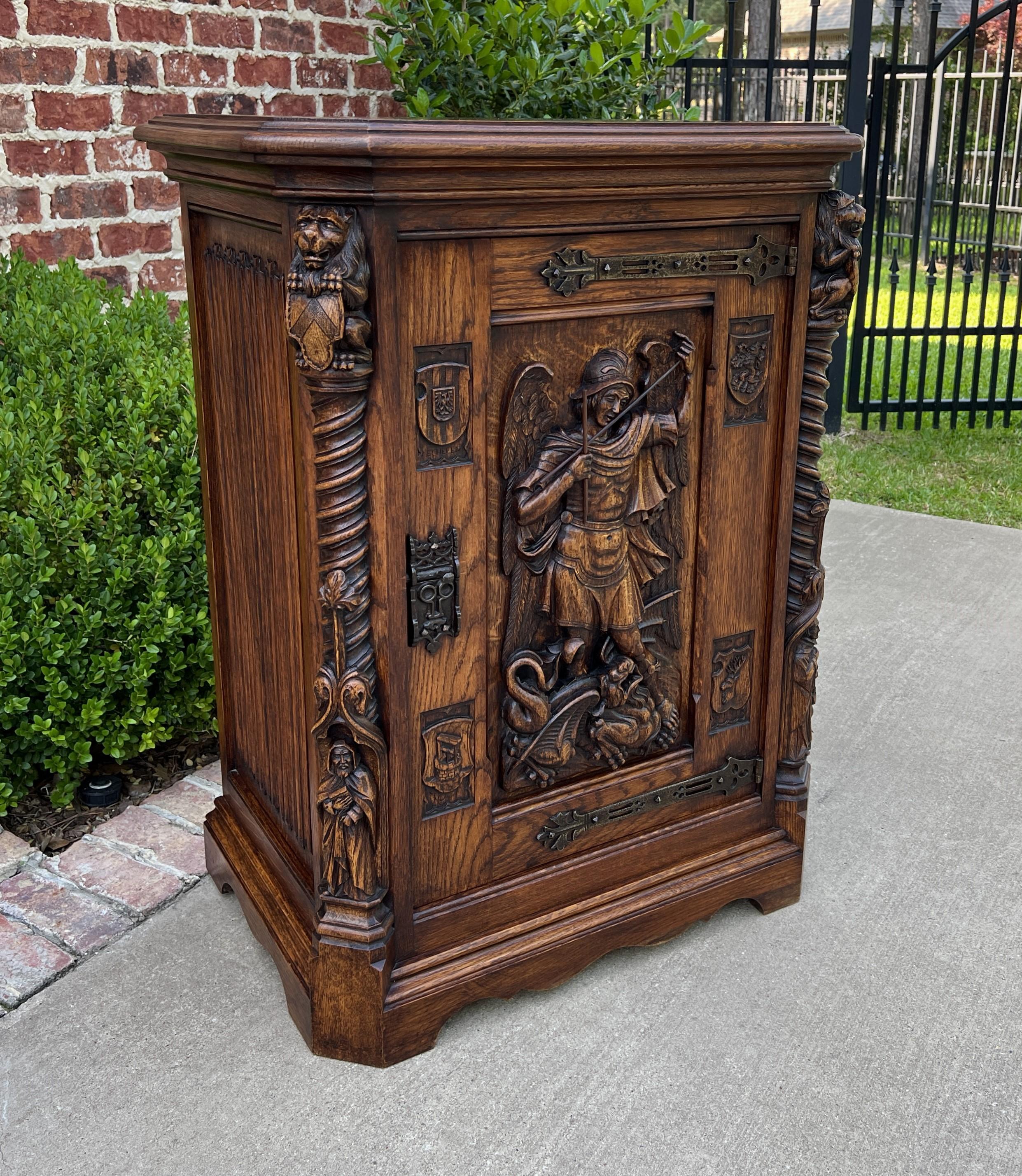 EXCEPTIONAL Antique French HIGHLY CARVED Oak Renaissance Revival Cabinet~~Barley Twist~~Archangel St. Michael~~Lions~~Monks~~c. 1880s 

Perfect statement piece that can accommodate any number of storage needs in today's home~~use in a bedroom or