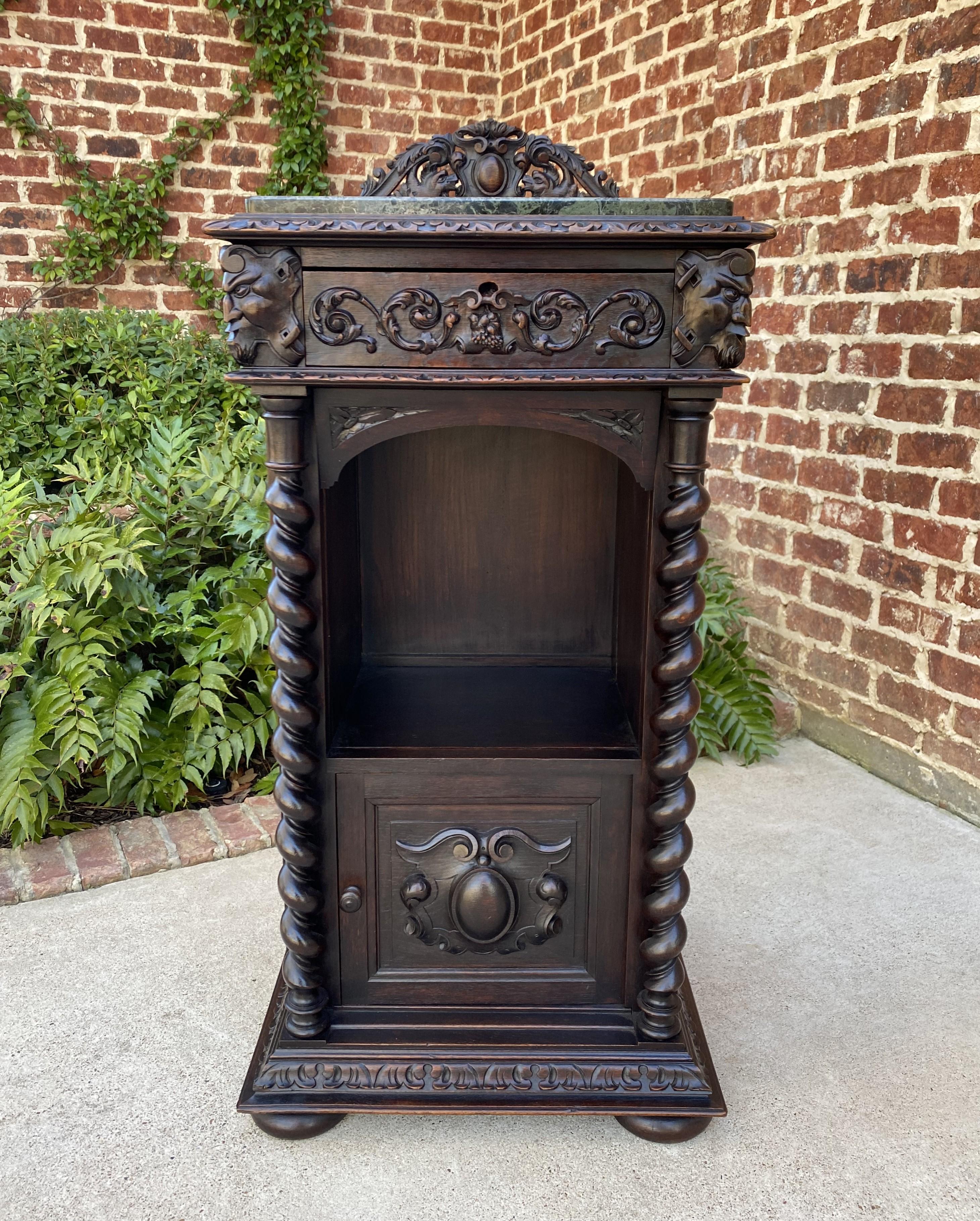 Antique French oak Renaissance gothic revival highly carved cabinet, buffet, bar, wine or liquor cabinet
~~c. 1880s

Fabulous antique carved cabinet with marble top, open barley twist posts, hand-cut dovetailed drawer and lower marble lined