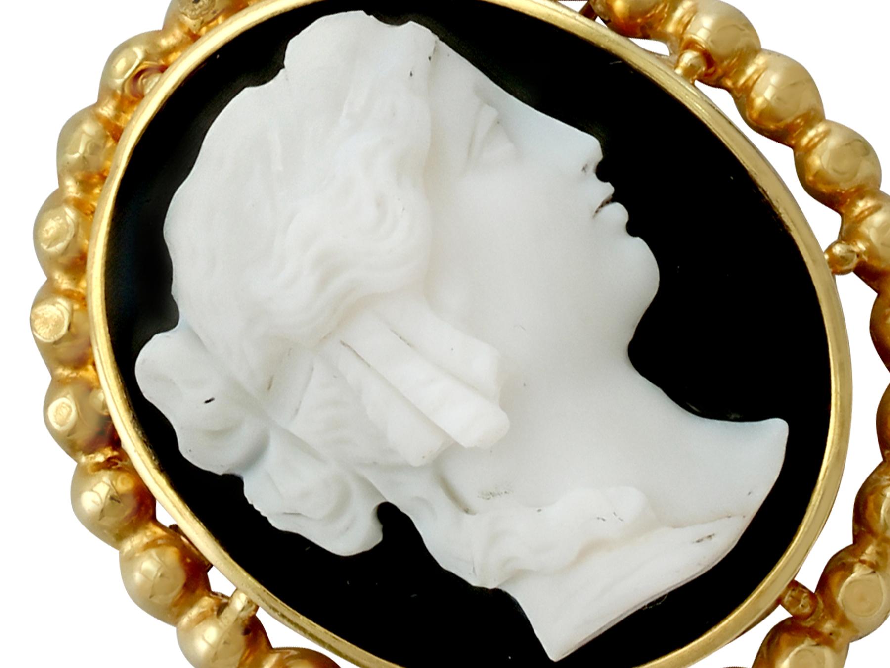 A fine and impressive antique French 18 karat yellow gold cameo brooch / pendant; part of our antique jewelry and estate jewelry collections.

This fine antique French cameo brooch / pendant has been crafted in 18k yellow gold.

The oval cameo is