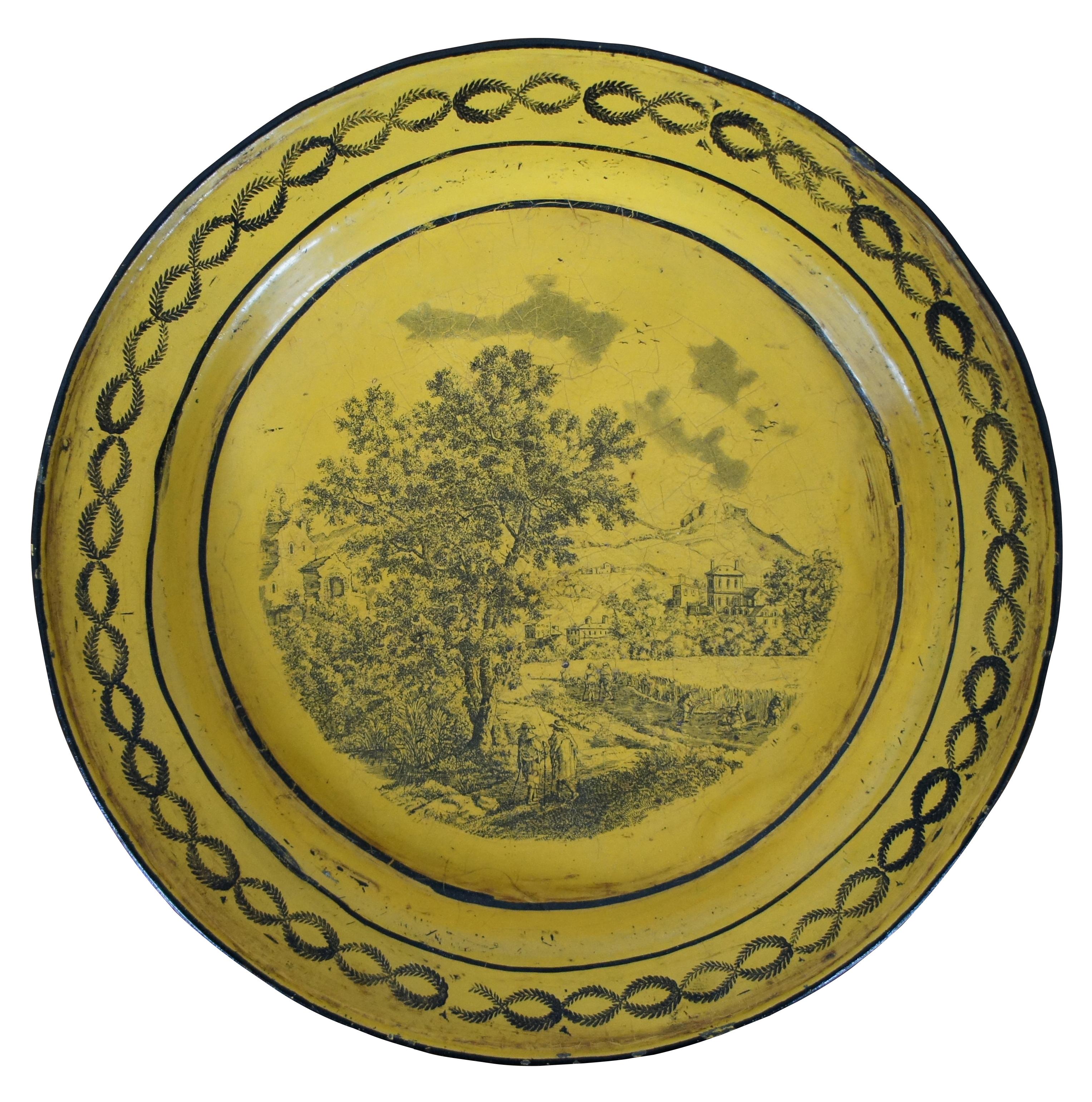 Antique metal tole ware Faience plate in mustard or canary yellow with transferware landscape scene and laurel wreath border. Measure: 9
