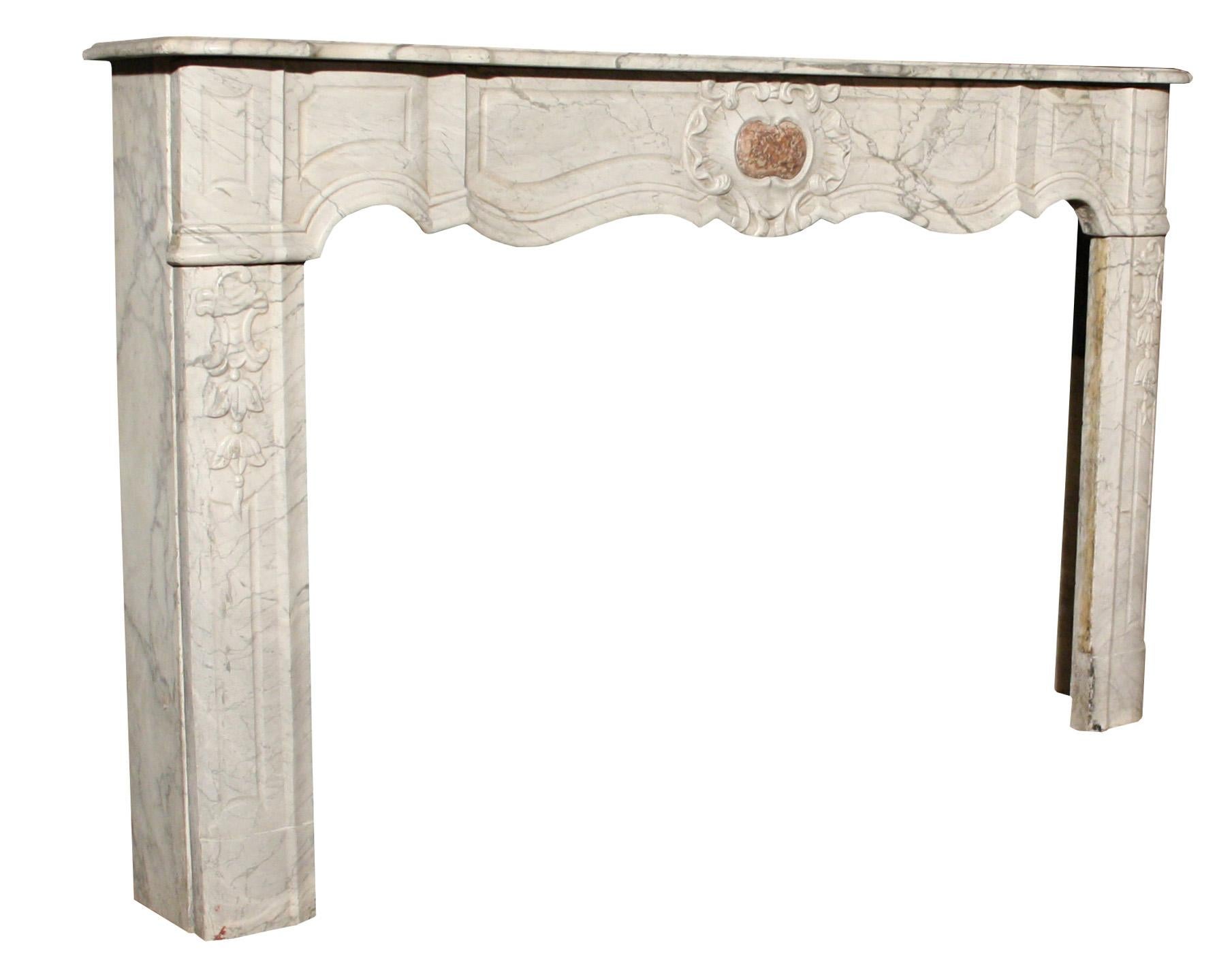 Carved with shaped panels and Brocatelle centre.

Additional dimensions:

Depth 25 cm (approx. 5 cm of mantel set into the wall)

Opening height 84.5 cm

Opening width 143.5 cm

Width between outside of the legs 177.5 cm.