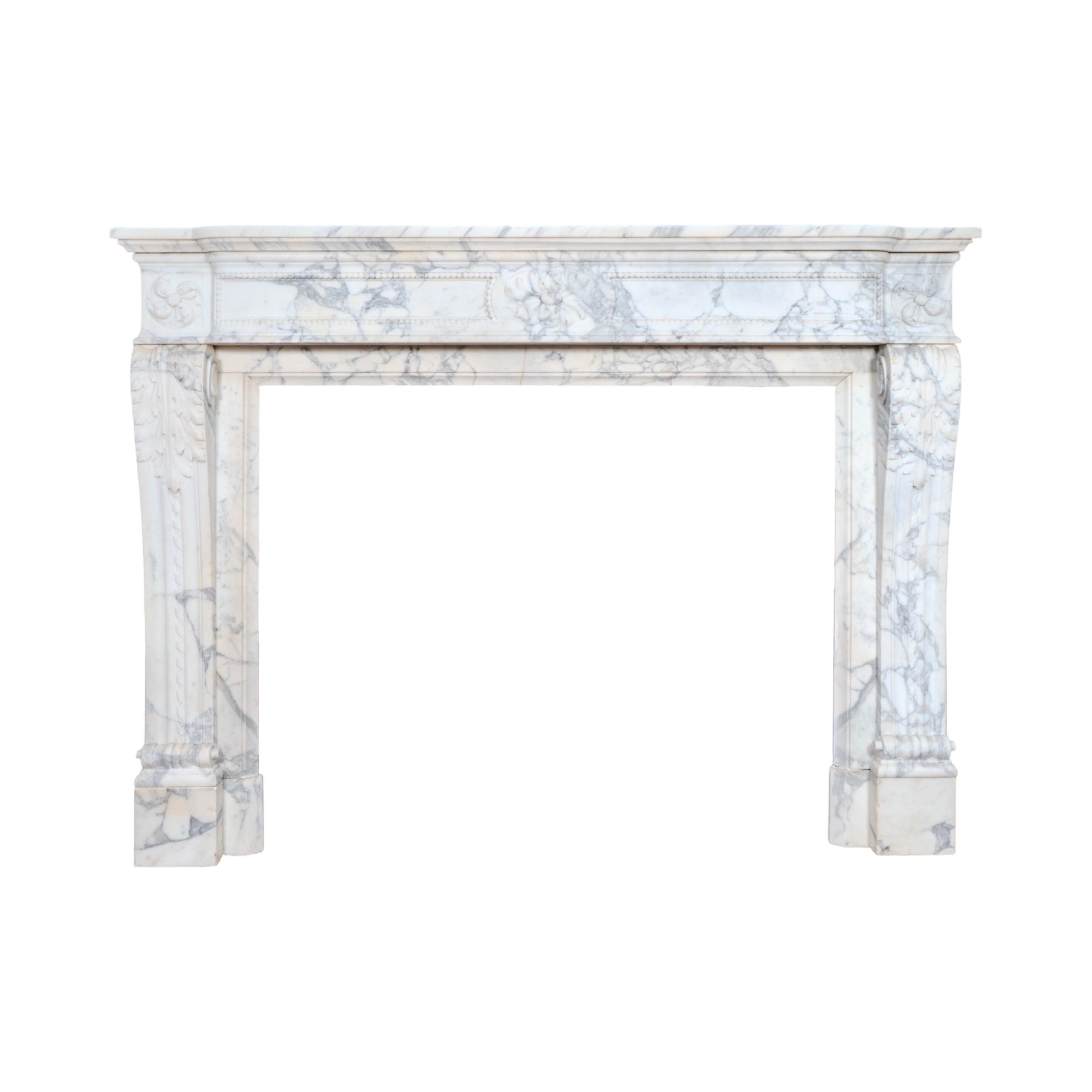 An exquisite 19th-century mantel from France, hand-carved from fine Carrara marble, celebrated for its luminous white surface and elegant grey veining. This antique piece showcases the refinement of French craftsmanship and timeless design.

The