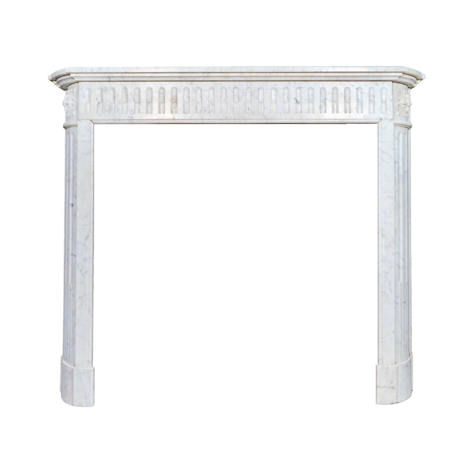 A graceful 19th-century mantel from France, carved from luminous Carrara marble, prized for its soft white ground and delicate grey veining. Antique and reclaimed, this piece carries both history and elegance, making it a timeless addition to any