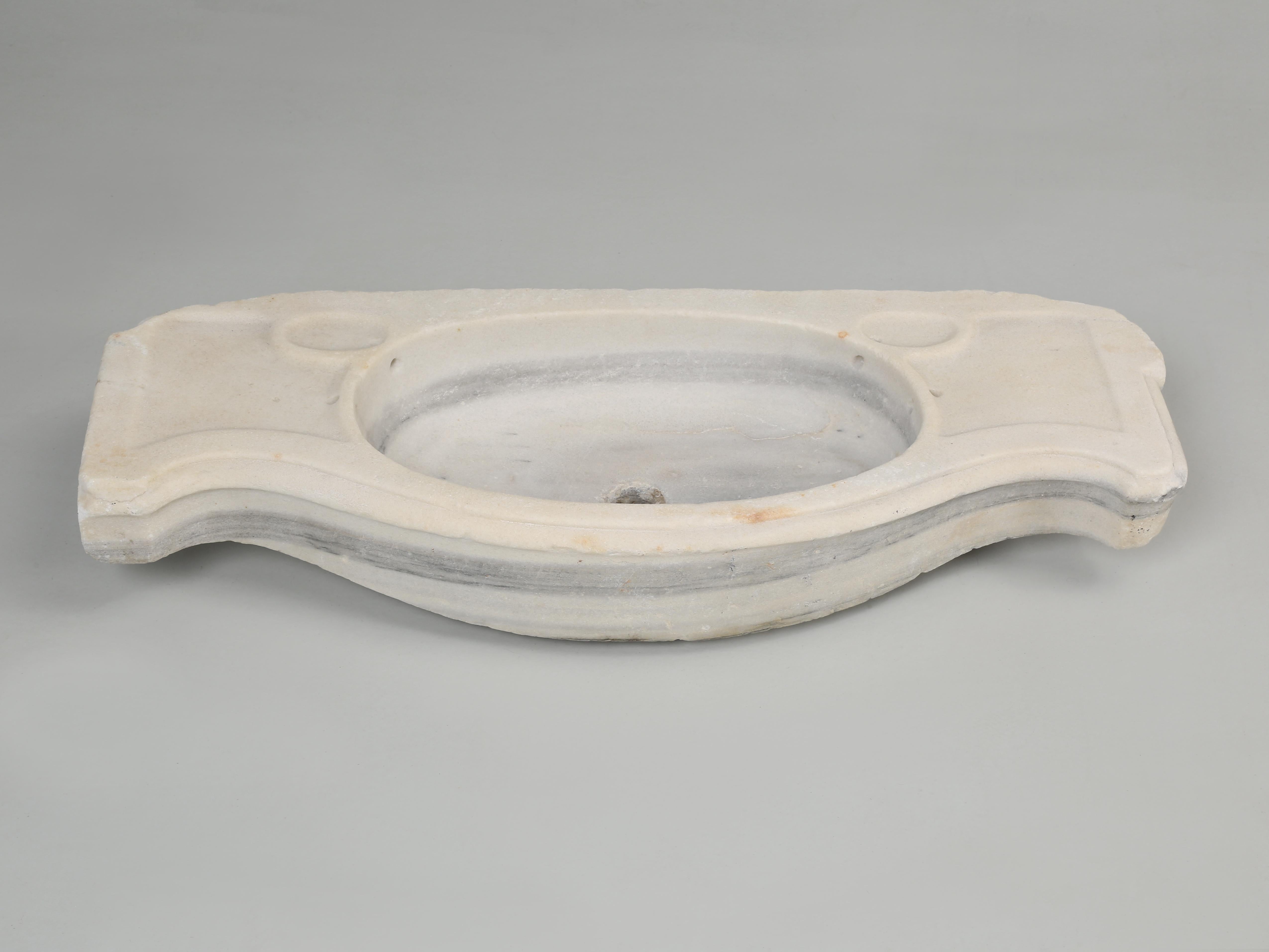 Antique marble sink imported from France, but could have been made in Italy. The sink is in nice original condition, considering that it's probably around 150-years old. When dealing with antique stone items, it's nearly impossible to pinpoint an