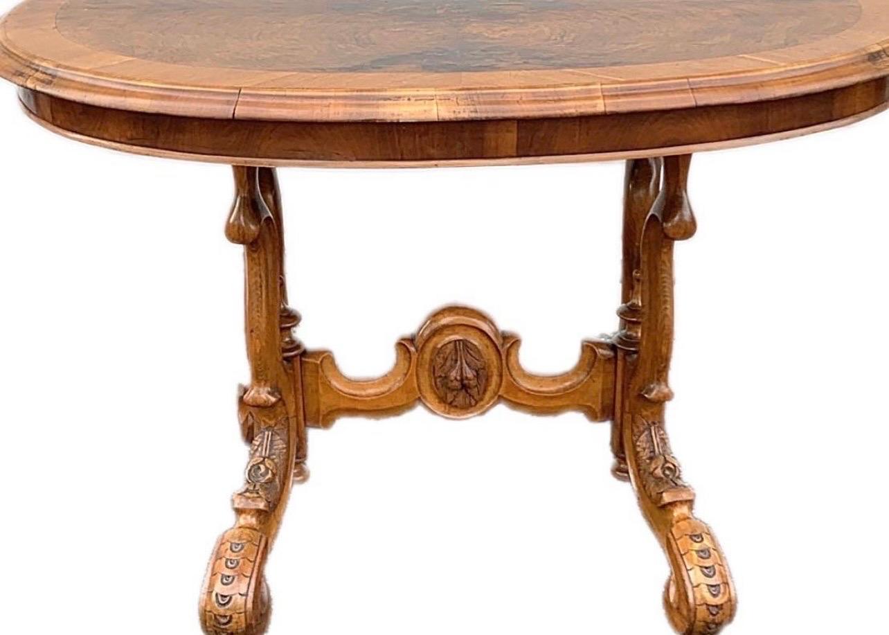 Antique 19th c. French Carved Burl Walnut Oval Table. Heavily carved scroll legs. Measures 29
