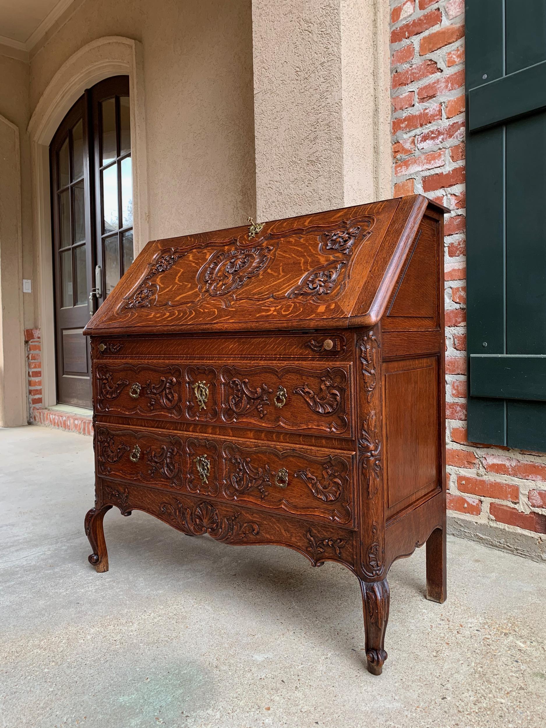 Antique French carved dark oak secretary desk bureau drop front Louis XV style

~ Direct from France
~ A lovely antique French carved “drop front” secretary/desk with quintessential French style from top to bottom!
~ Carved oak French “drop