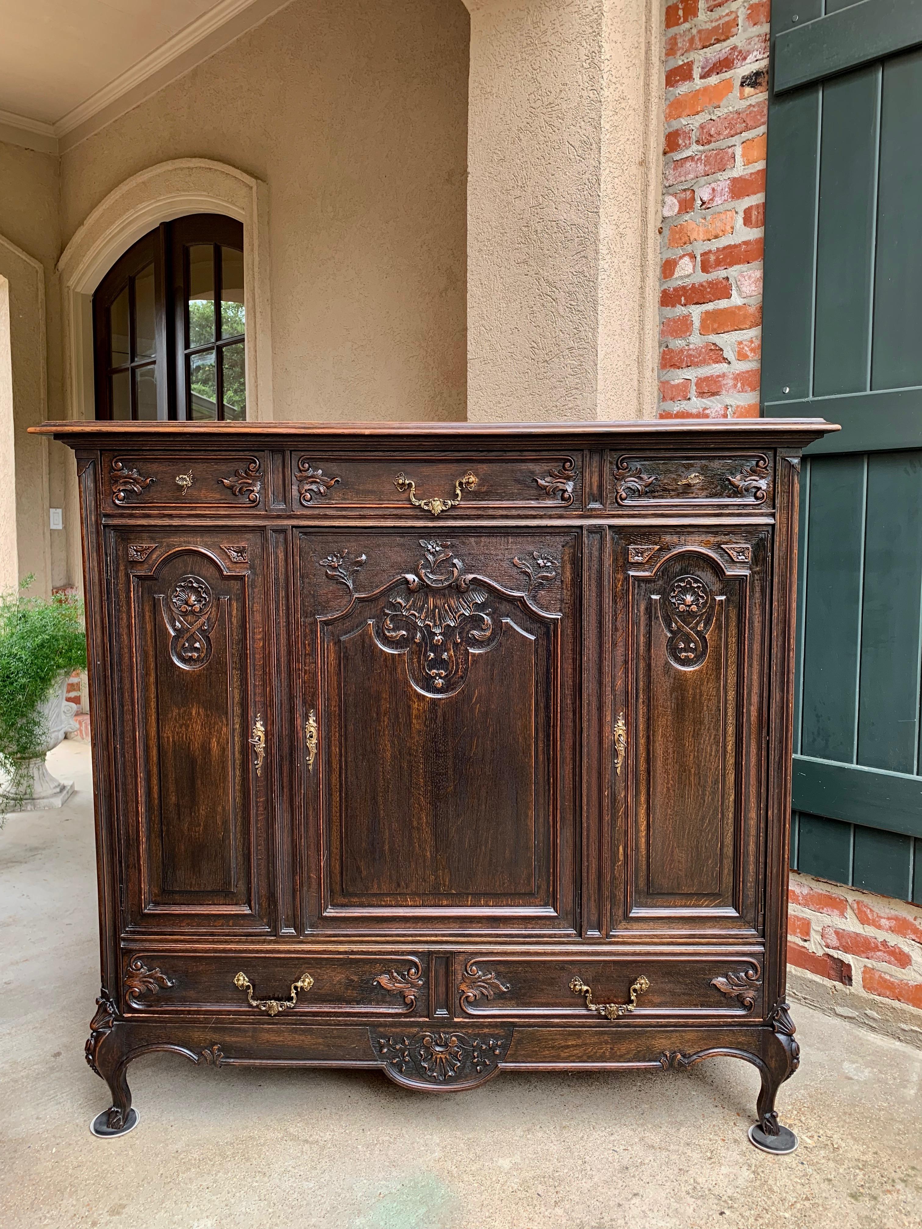Direct from France, this gorgeous carved Louis XV style cabinet is one of a matching pair purchased directly from an estate in France. We are selling the cabinets separately
~Extra tall with an elegant French silhouette and carved from top to