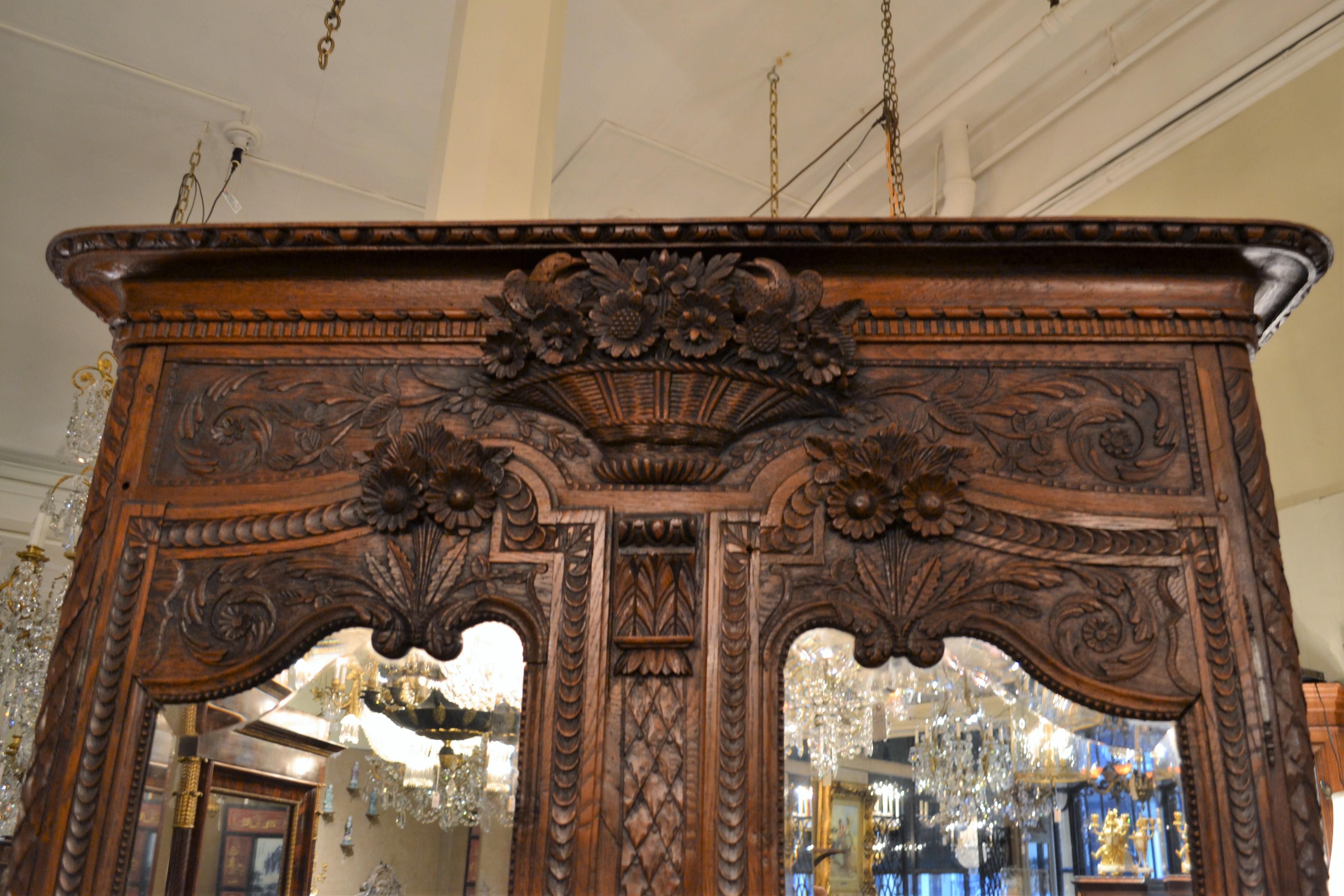 French Provincial Antique French Carved Elm Armoire with Beveled MIrror Doors For Sale