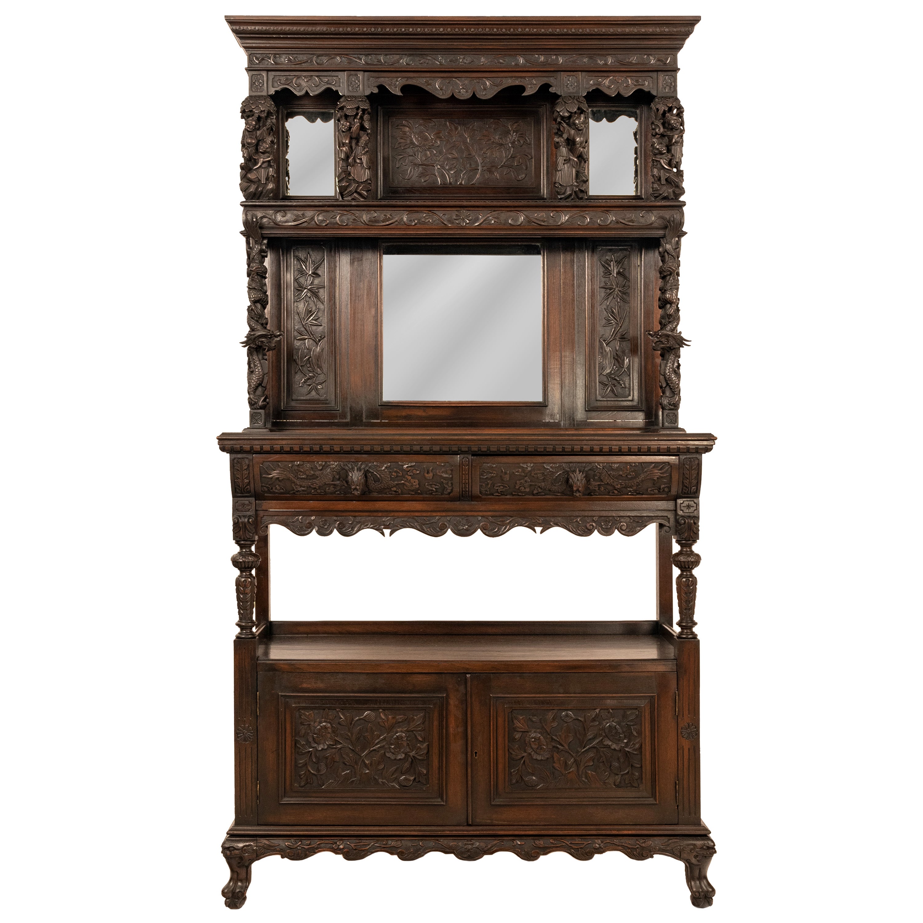 A superb antique carved French mahogany etagere/buffet in the Chinoiserie style, circa 1875.
The cabinet in two sections having a carved cornice to the top with twin mirrors and a shelf below with four carved supports of Oriental figures and a