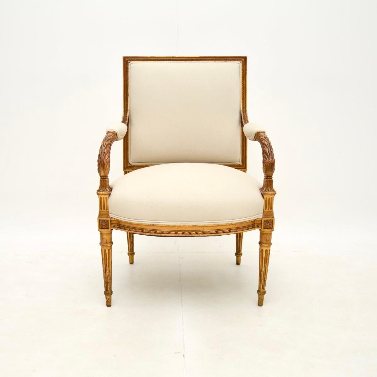 A beautiful antique French carved gilt wood armchair, dating from around the 1860-1880 period.

This is of very good quality, with gorgeous carving throughout. It sits on turned and fluted legs, with acanthus leaf carving and scrolled armrests. The