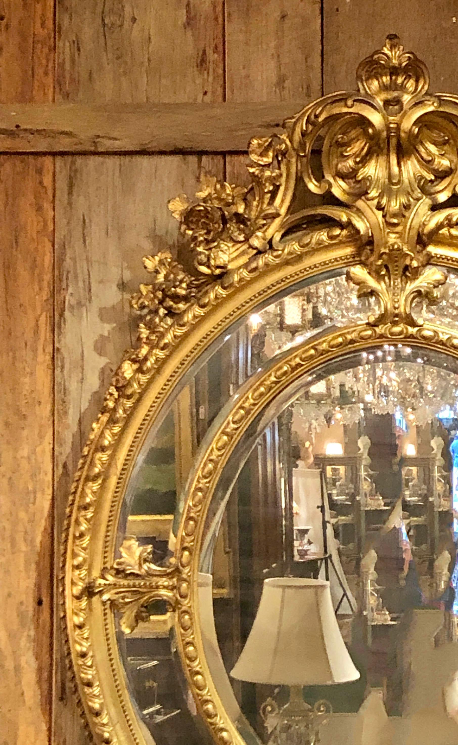 Large Antique French Finely Carved Gilt Wood Oval Mirror with Beveling, circa 1870-1890