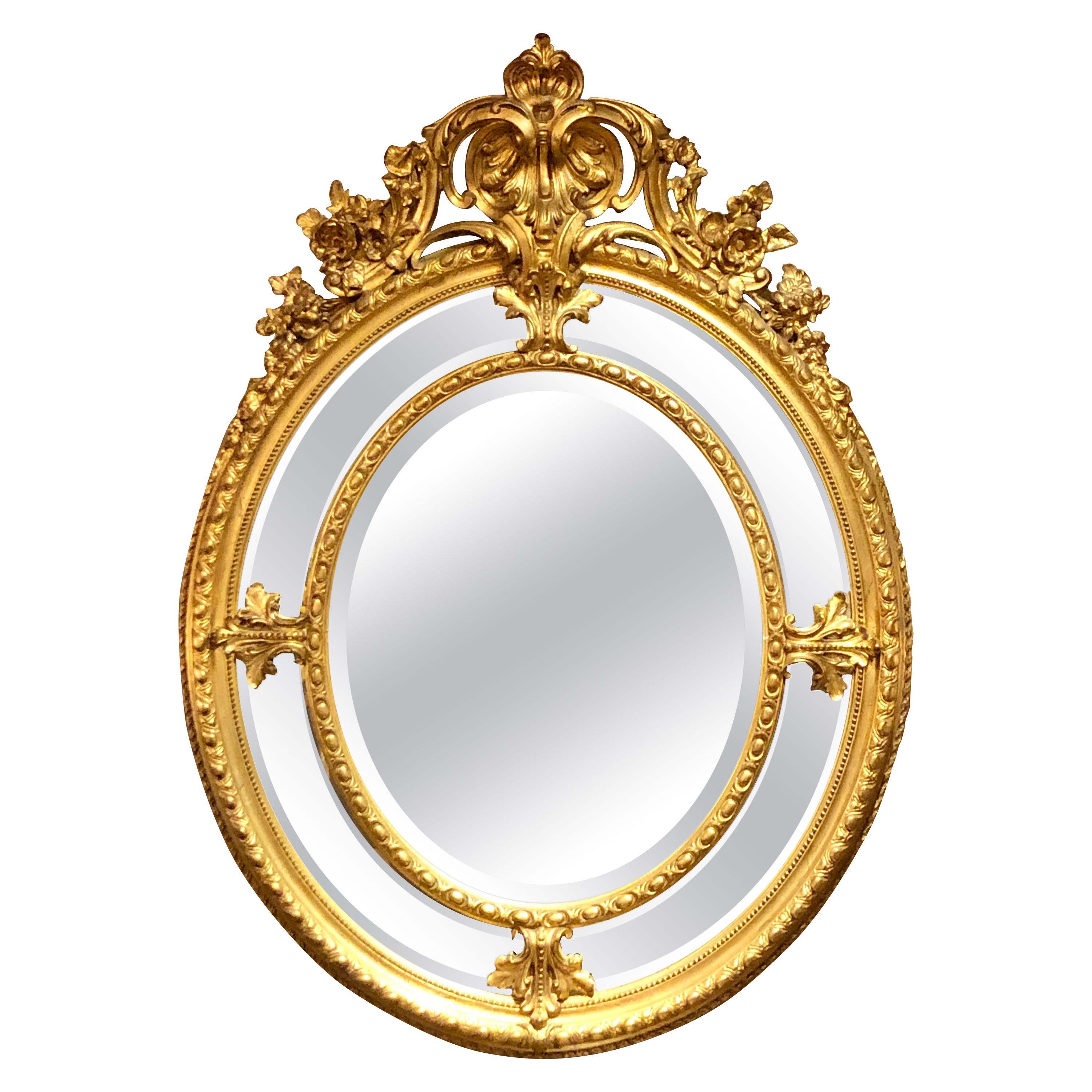 Antique French Carved Gilt Wood Oval Mirror with Beveling, circa 1870-1890