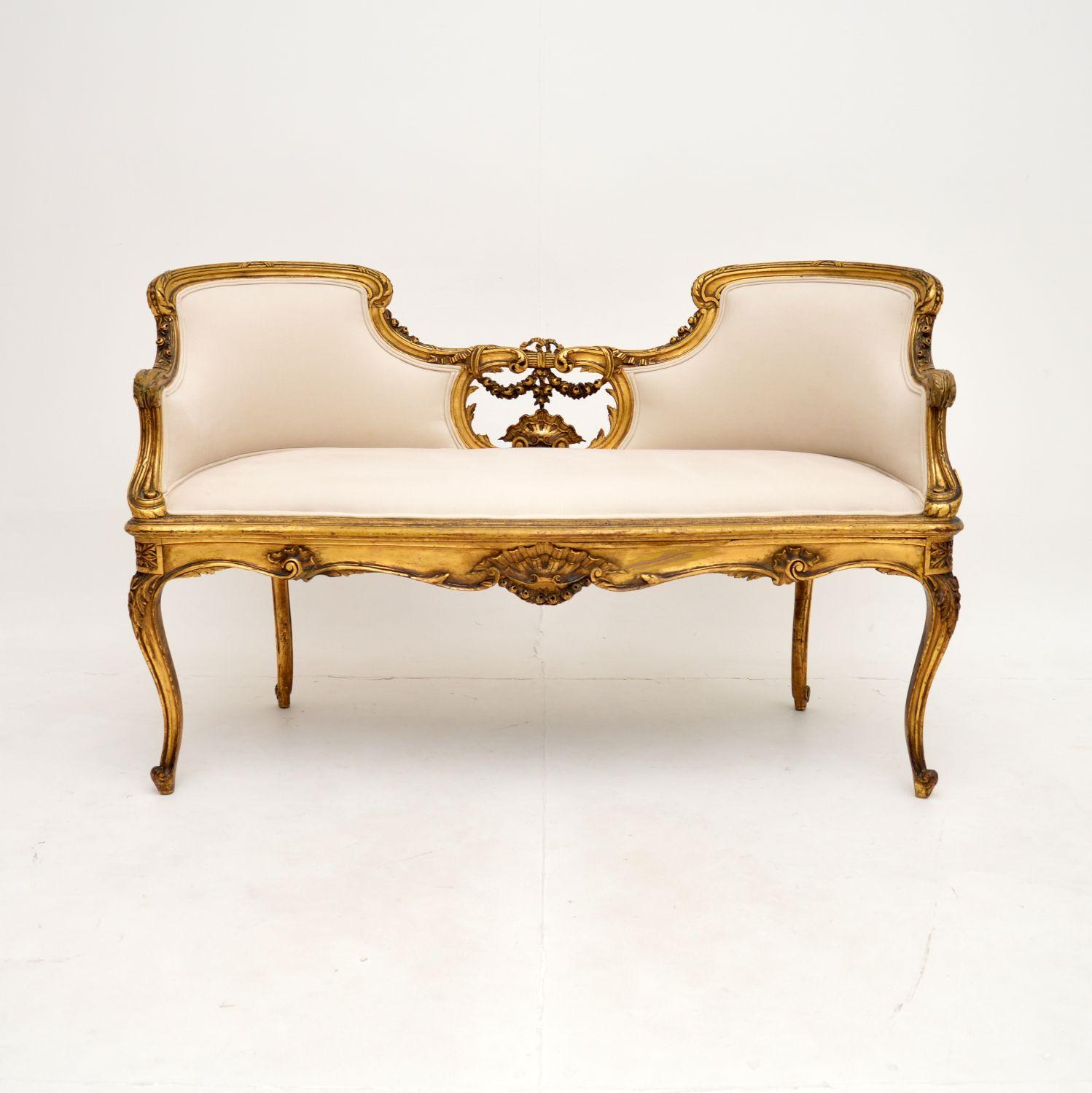 An absolutely stunning antique French carved gilt wood settee of the highest order. This was made in France, it dates from around the 1880-1900 period.

It is of amazing quality, with beautiful and intricate carving throughout. It is a lovely size,