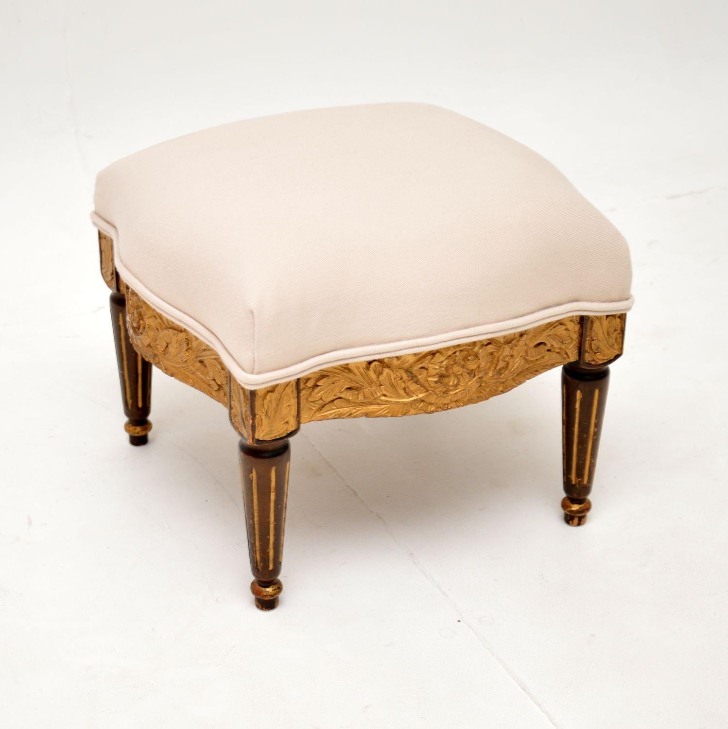 A beautiful little antique French stool in carved gilt wood, dating from around the 1910-20’s.

This is very well made and has a gorgeous design. It is square shaped, with serpentine sides, crisp carving around the edges and turned, fluted