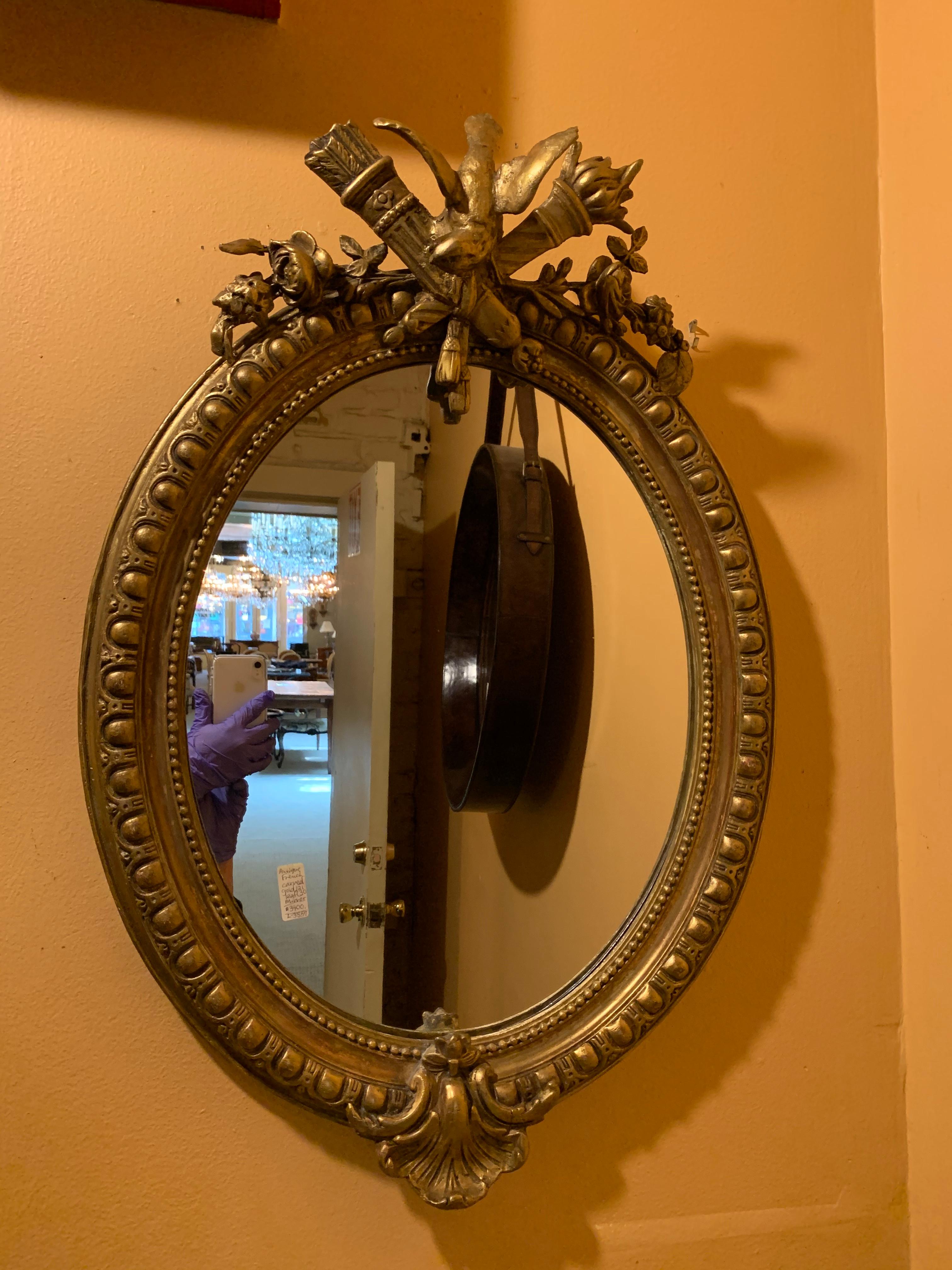 Antique French carved gold leaf mirror.