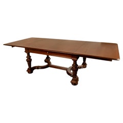 Antique French Carved Mahogany Baroque Revival Dining Table with Two Leaves 1900