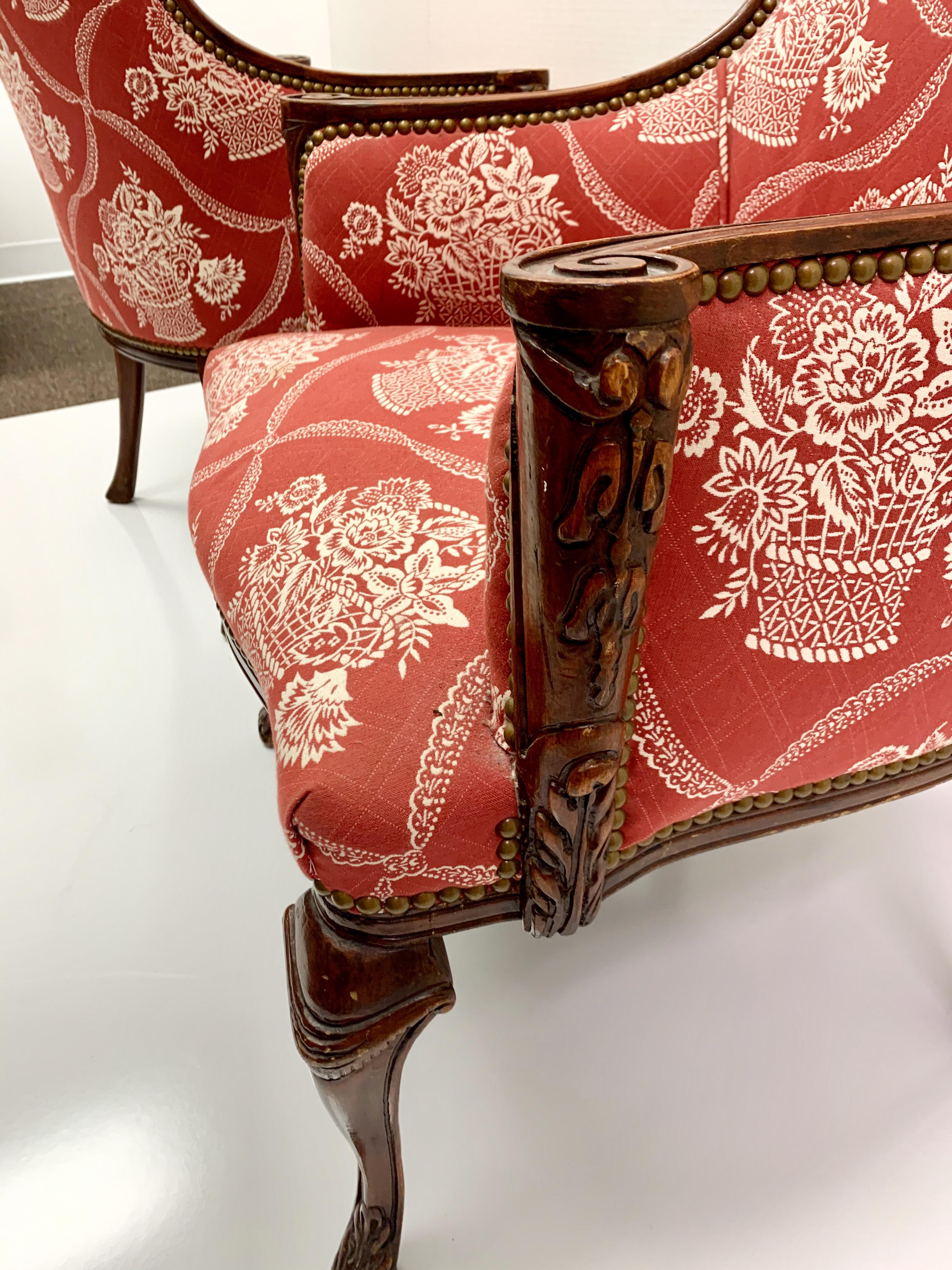 French Provincial Antique French Carved Mahogany Wing Chairs in Schumacher Fabric, Pair For Sale