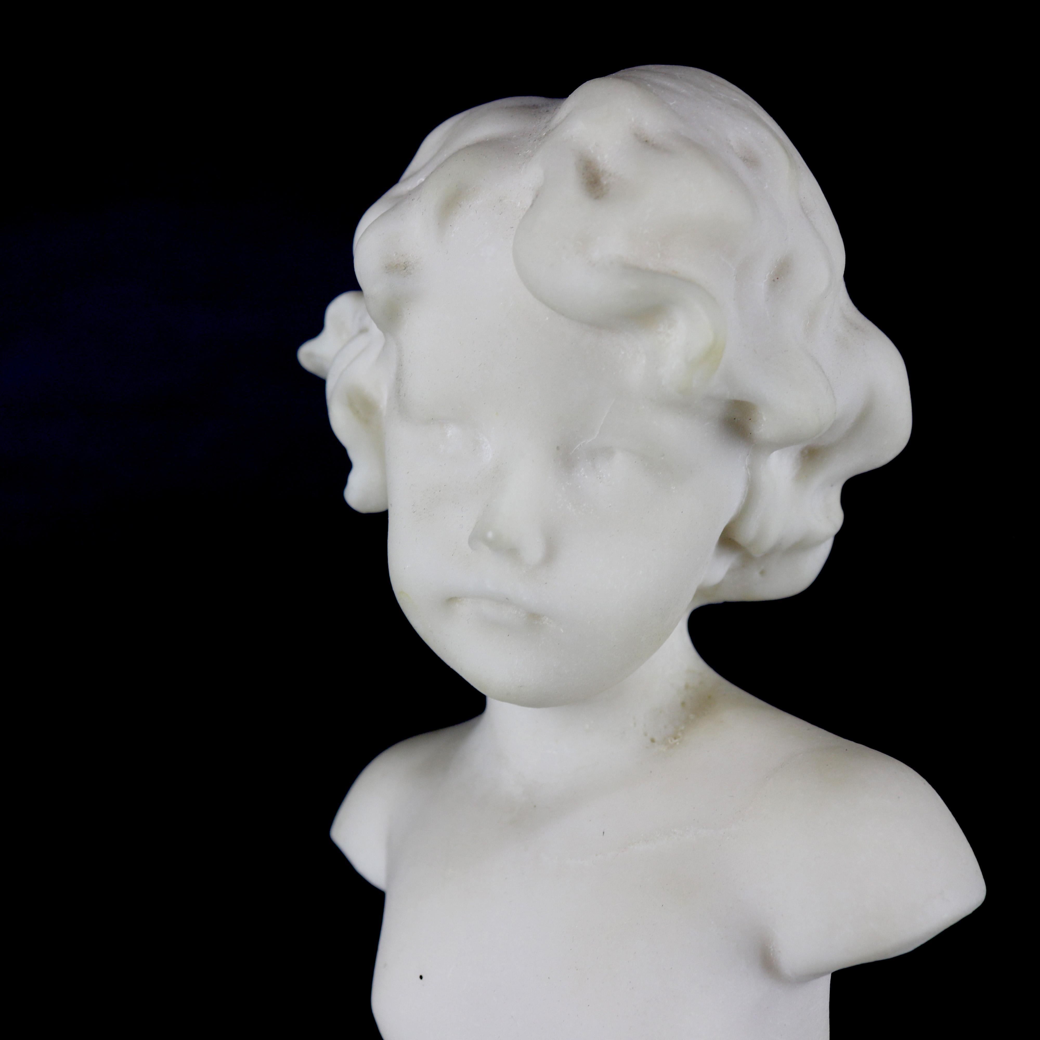 An antique French portrait sculpture offers carved marble bust of young child on plinth, circa 1890

Measures: 11