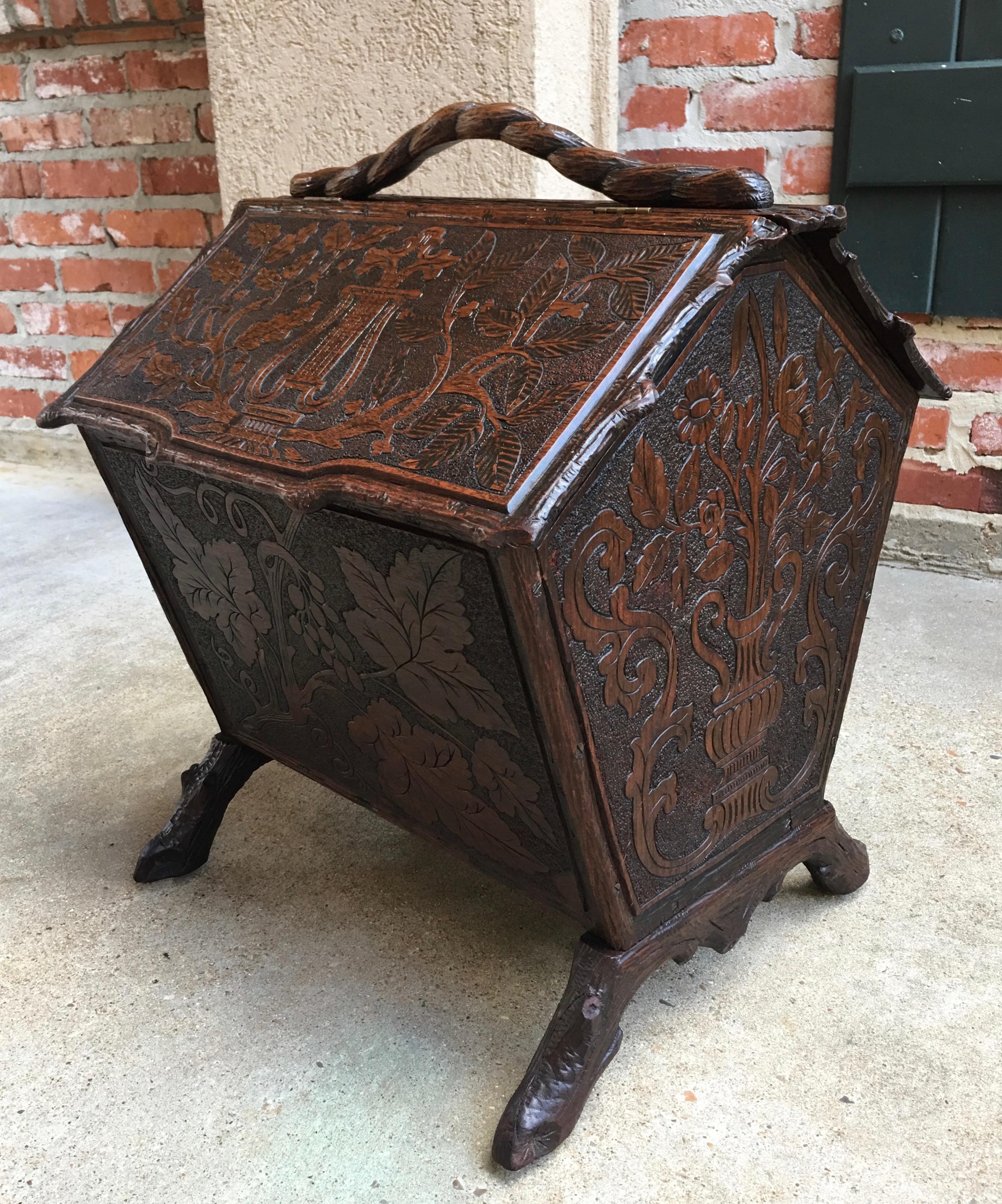 Direct from France, a lovely antique Black Forest carved box/stand, that I imagine was originally for sheet music~
~ Beautiful hand carvings on every surface, all four sides are completely covered!~
~ And in traditional Black Forest style, look at