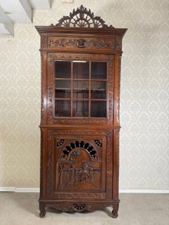 Antique French Carved Oak Cabinet with Figural Panel and Glazed Upper Section