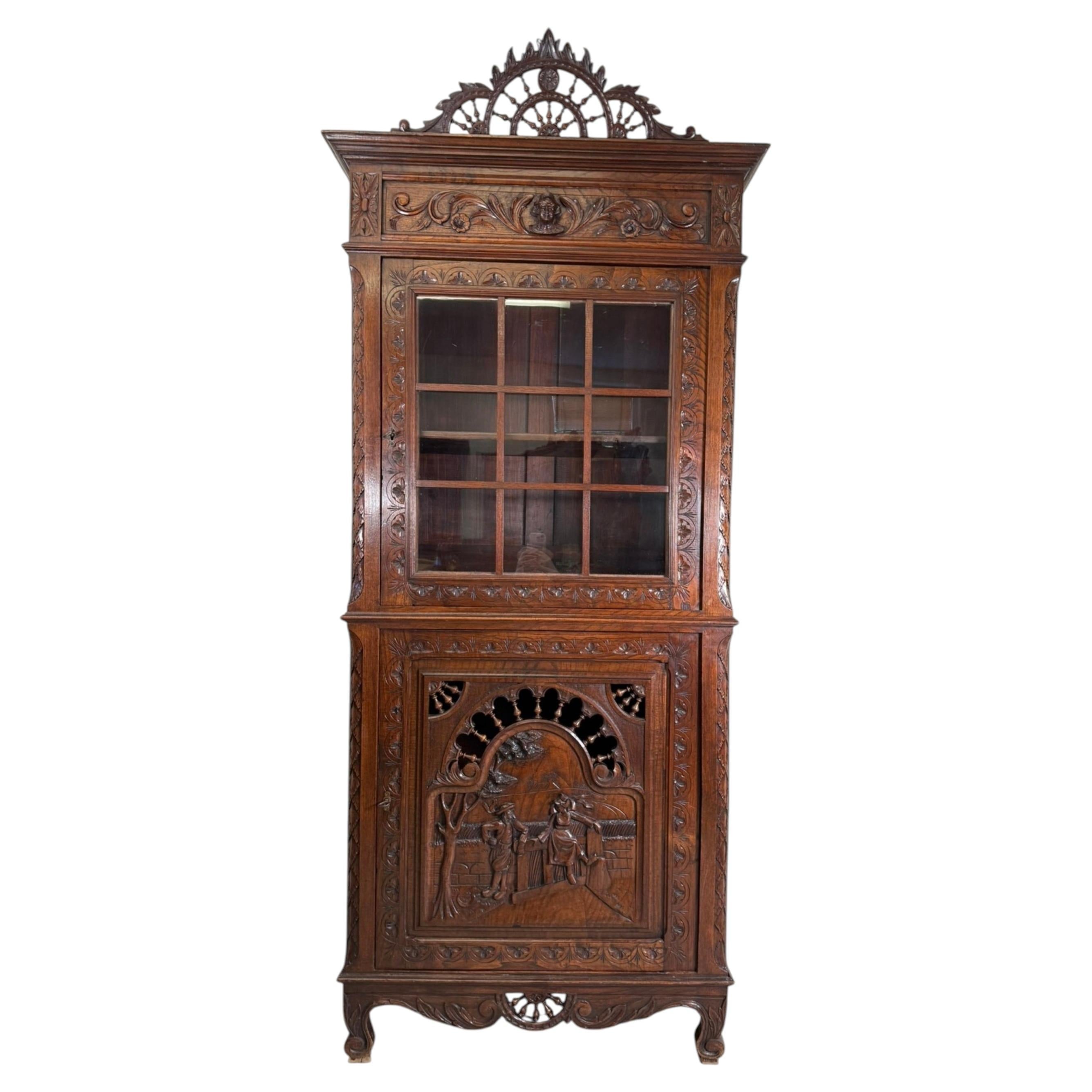 Antique French Carved Oak Cabinet with Figural Panel and Glazed Upper Section