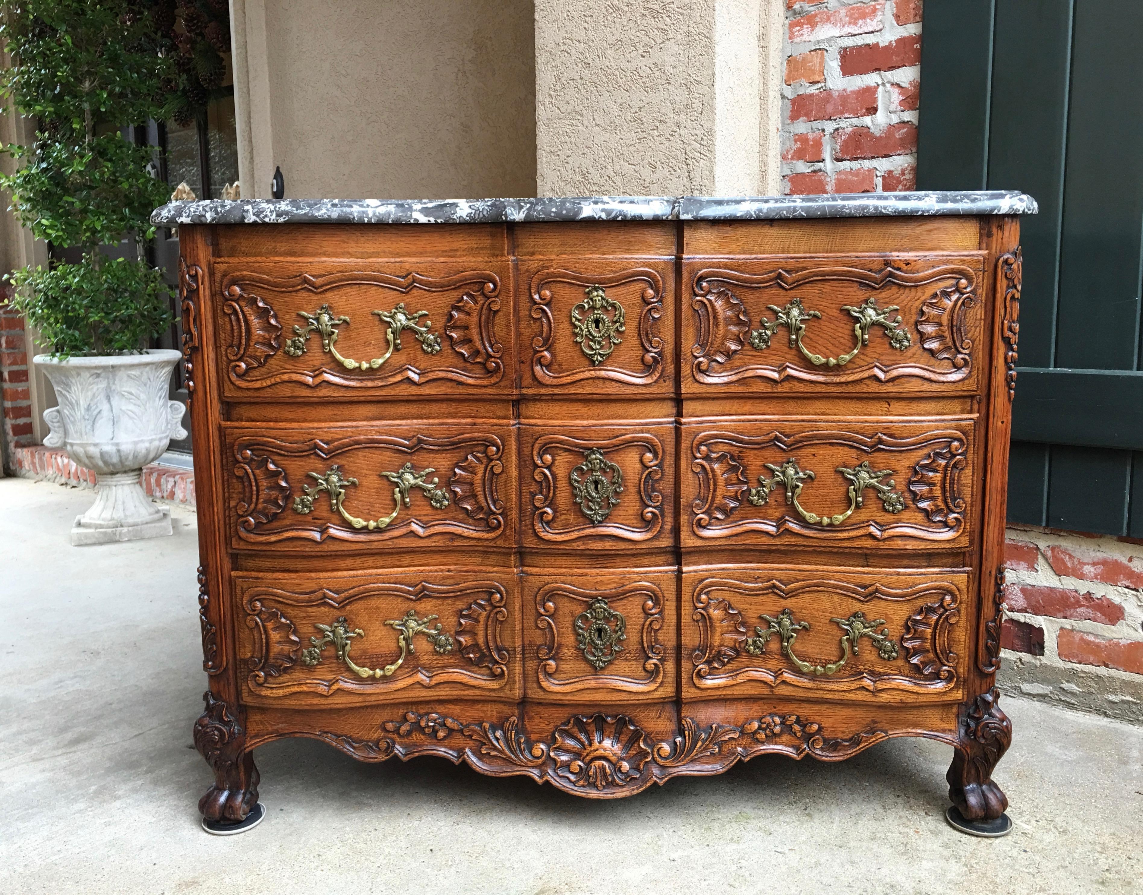 Direct from France, a large antique French chest or side table, in stunning Louis XV style!
~Serpentine shaped front and serpentine beveled marble top
~Massive carvings across the entire drawer fronts with exquisite shell design in lower carving