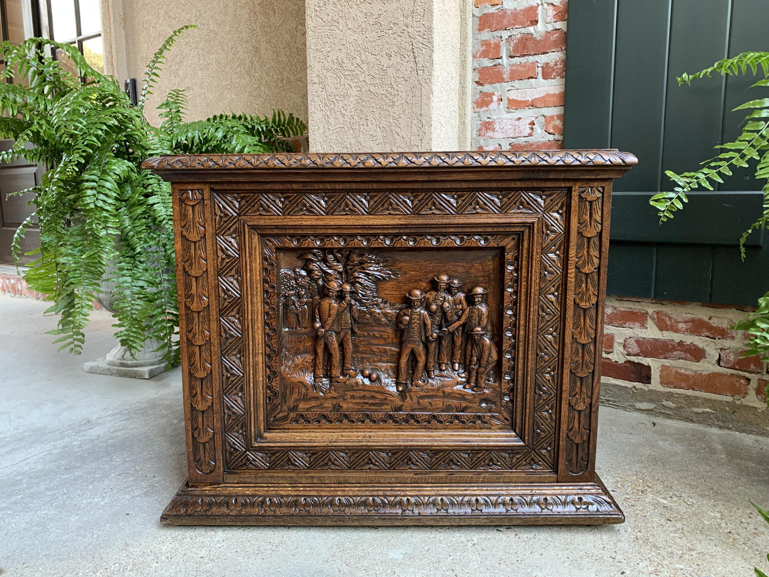 Antique French carved oak chest trunk cabinet Breton Brittany Bocce Ball 19th c

~Direct from France~
~Highly carved antique Brittany, France, lift top cabinet.~
~Carved, beveled edge on the lift top, with complimentary carved moulding to the