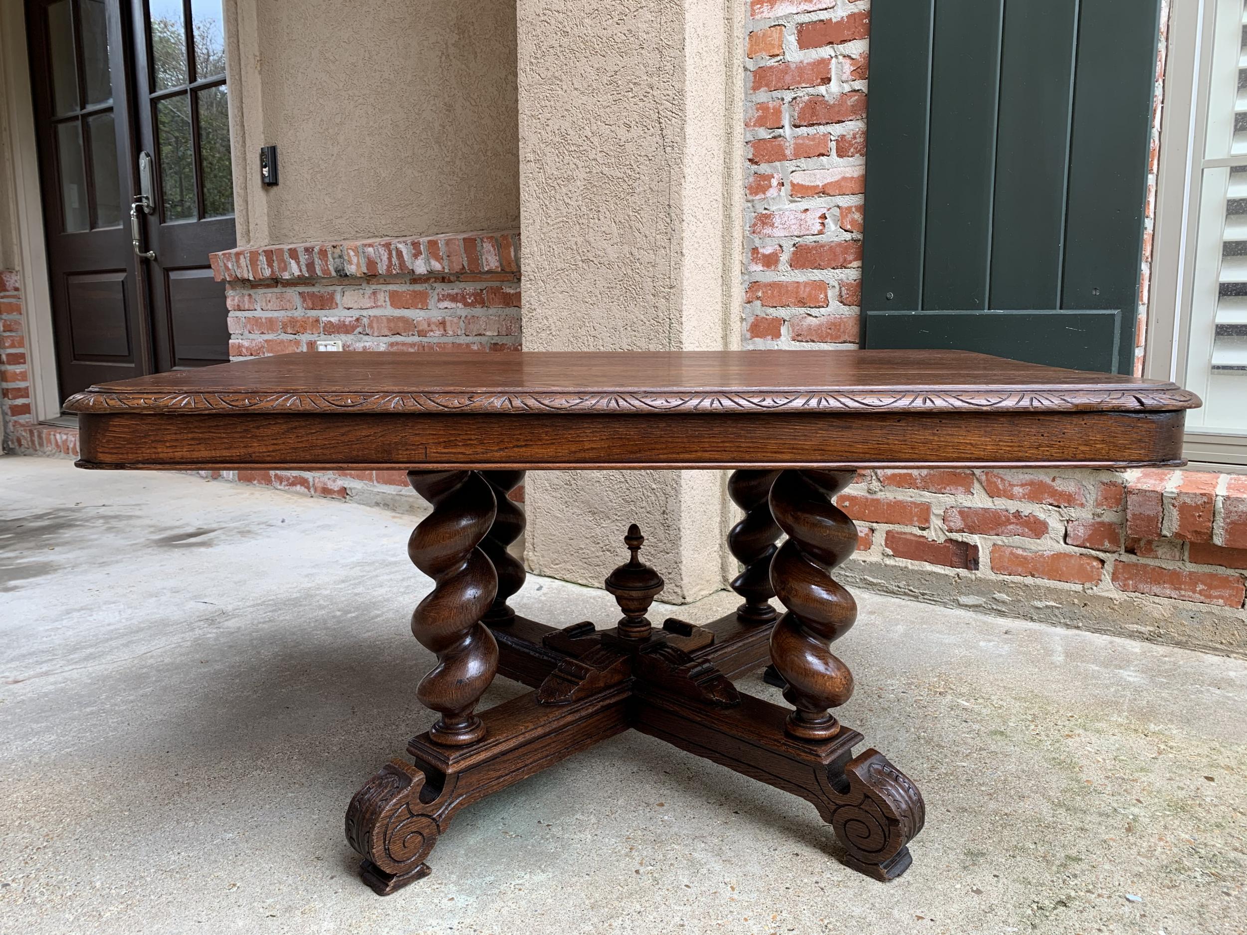 ~Direct from France~
~Lovely antique French oak coffee table, in a long, rectangular shape~
~Large base has four, thick, barley twist legs resting on an elevated base with carved serpentine feet. Center base features a carved platform with a large