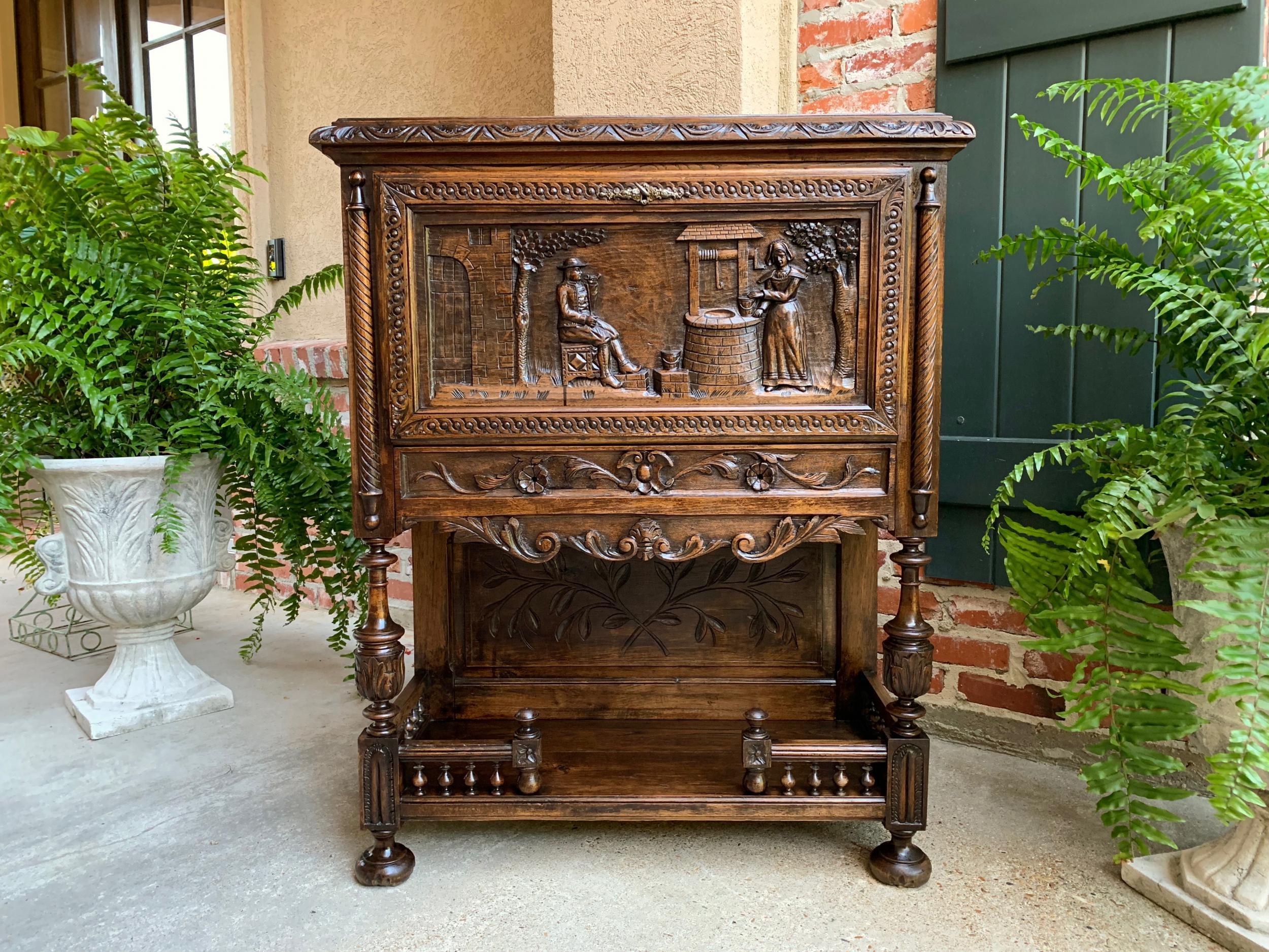 Antique French carved oak drop front desk liquor cabinet Breton Brittany 19th c

~Direct from France~
19th century French cabinet with stunning Brittany carvings throughout. Perfect for a storage piece, excellent as a writing desk, with it’s drop