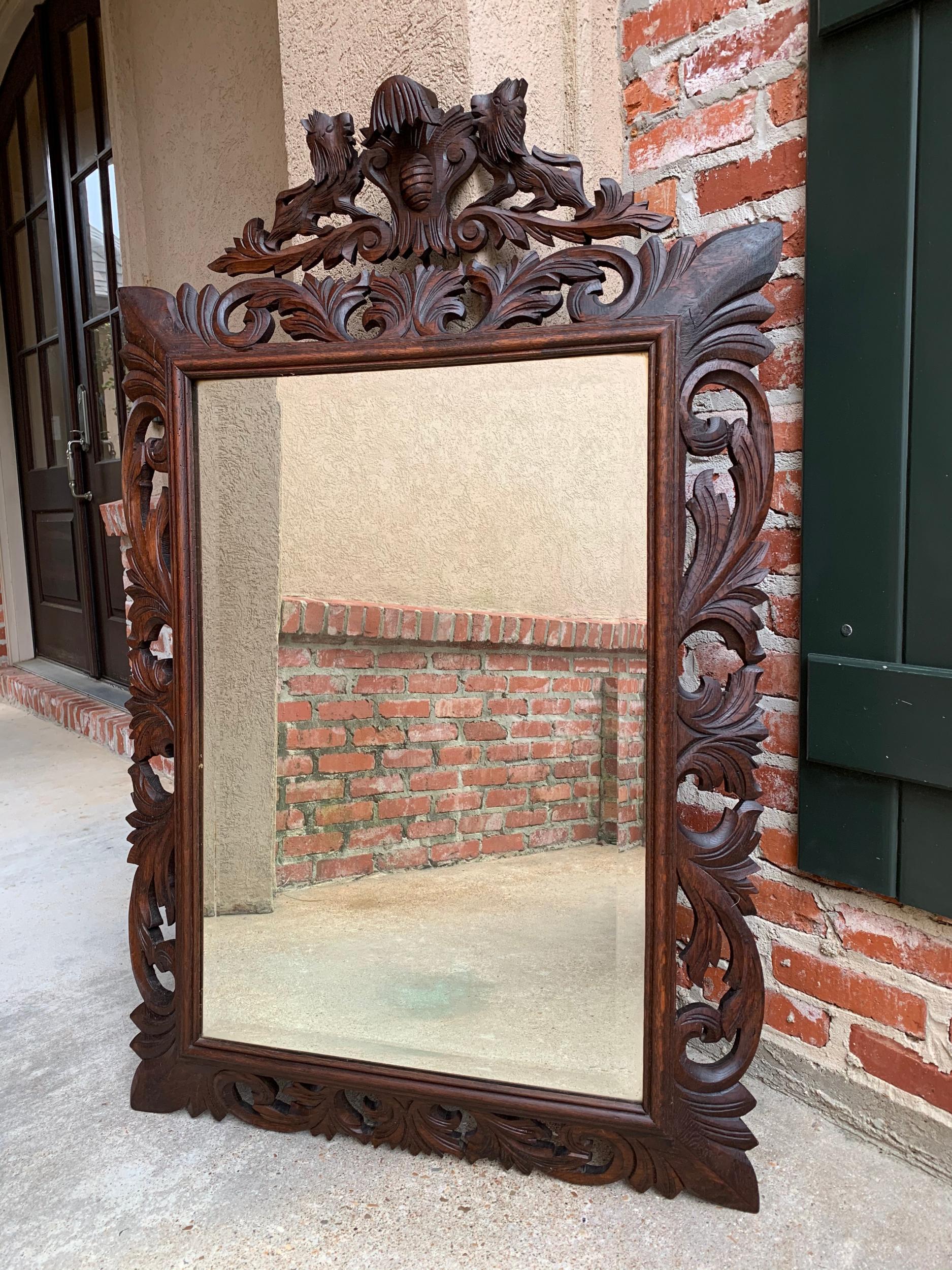 Antique French carved oak frame beveled mirror wall mantel Louis XIV Renaissance.

~Direct from France~
~Large and lovely antique carved French wall or mantel mirror~
~Wide frame, open carved on all sides, classic style that blends with any