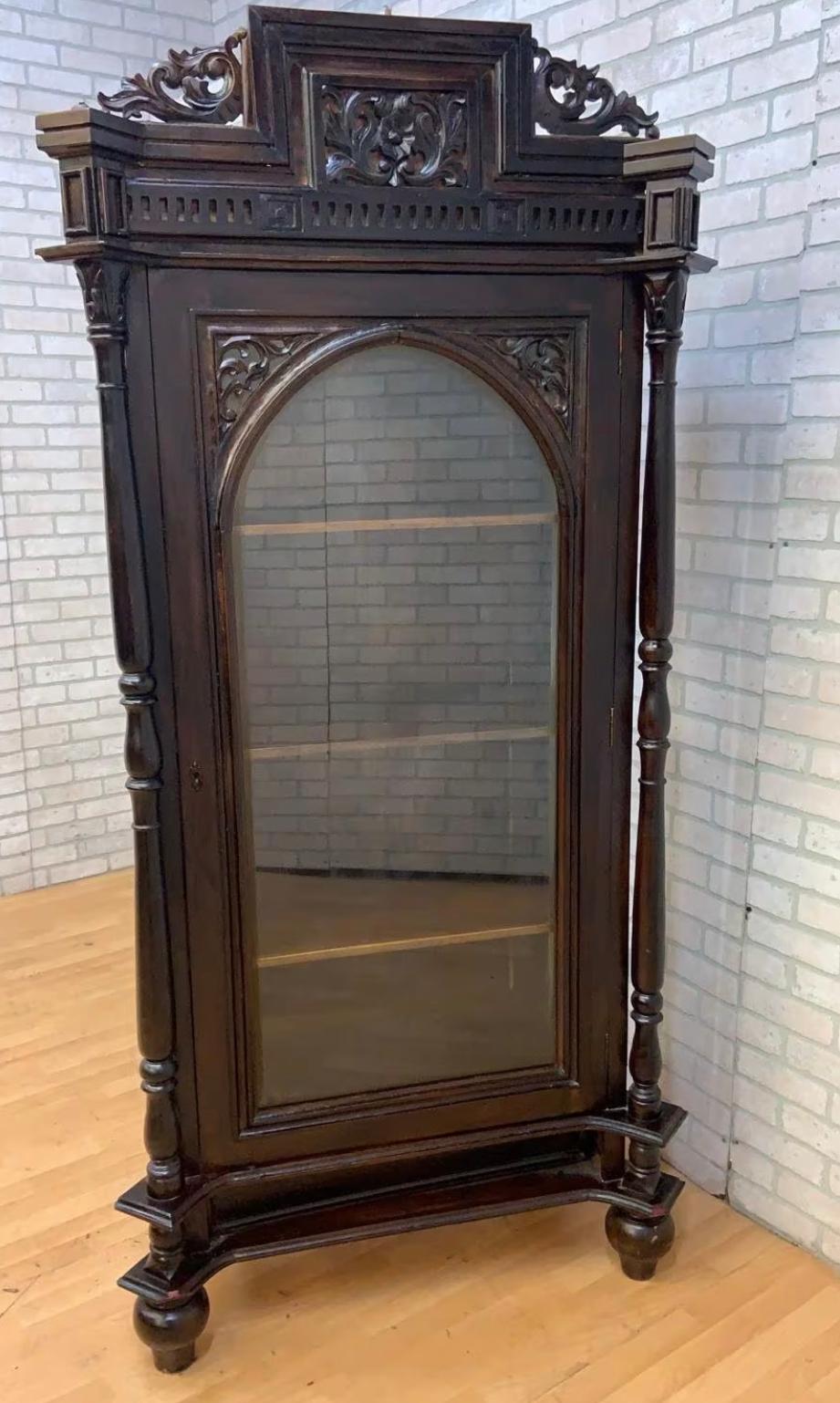 Antique French Carved Oak Glass Front Vitrine Display Cabinet

Gorgeous 19th Century French dark oak single glass front door vitrine/display cabinet. Beautifully crafted with finely carved scrolled acanthus leaf accents and trim, a single door with